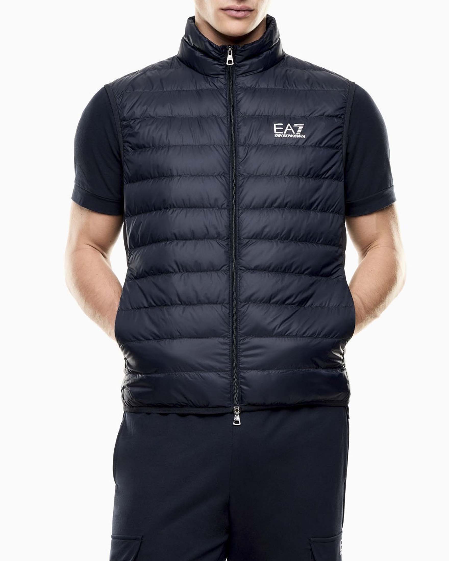 Gilet EA7 blu in nylon trapuntato con logo frontale stampato e imbottitura in piuma image