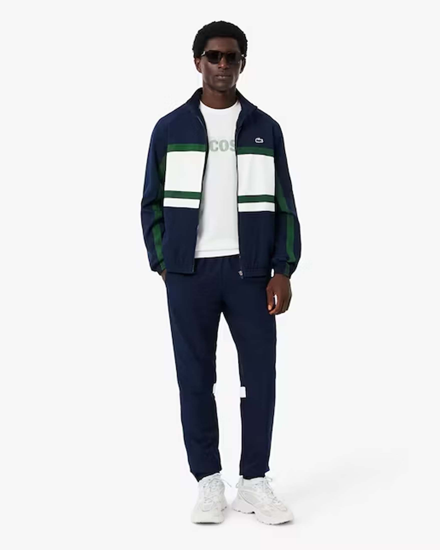 Tuta Lacoste color block blu bianca e verde con maxi stampa coccodrillo sul retro