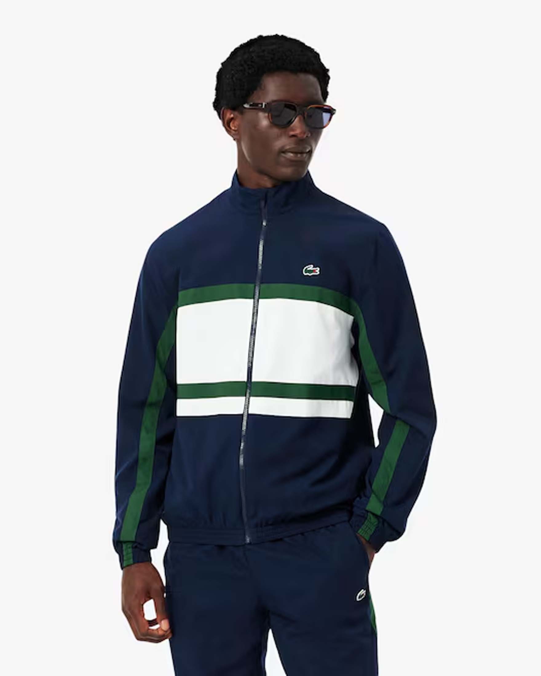 Tuta Lacoste color block blu bianca e verde con maxi stampa coccodrillo sul retro image