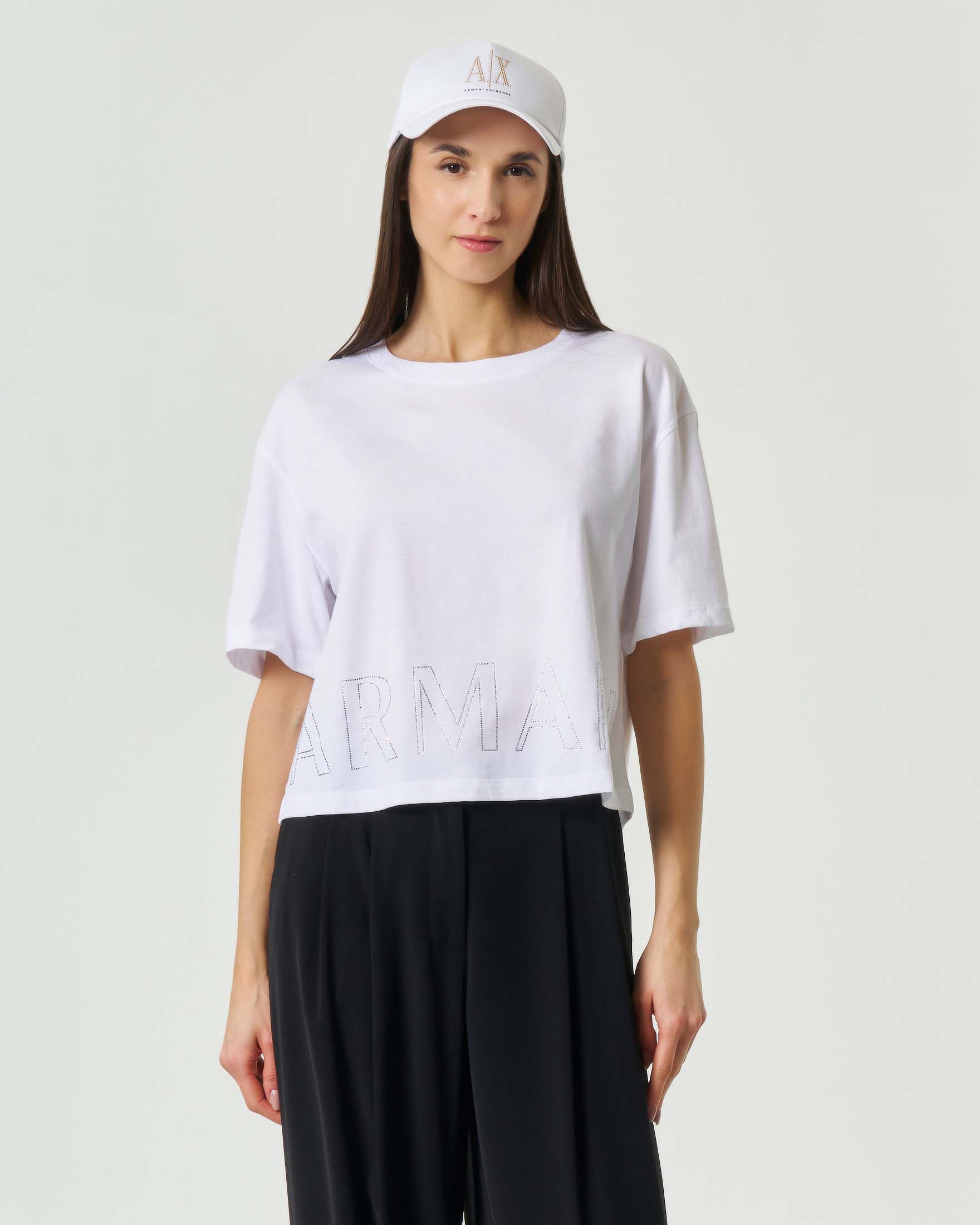 T-shirt cropped girocollo maniche corte Exchange bianca con maxi scritta logo in strass