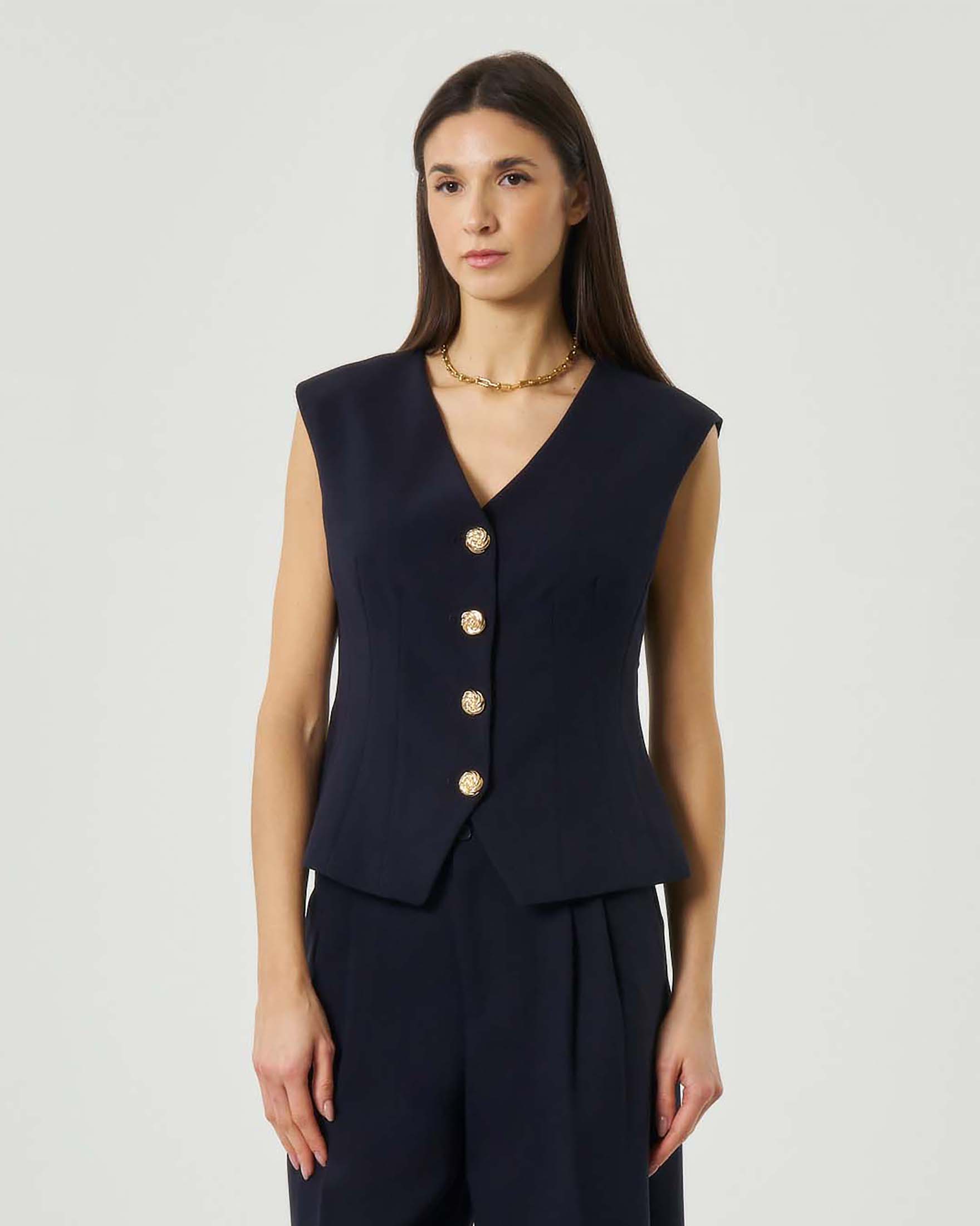 Gilet blu sagomato con bottoni dorati