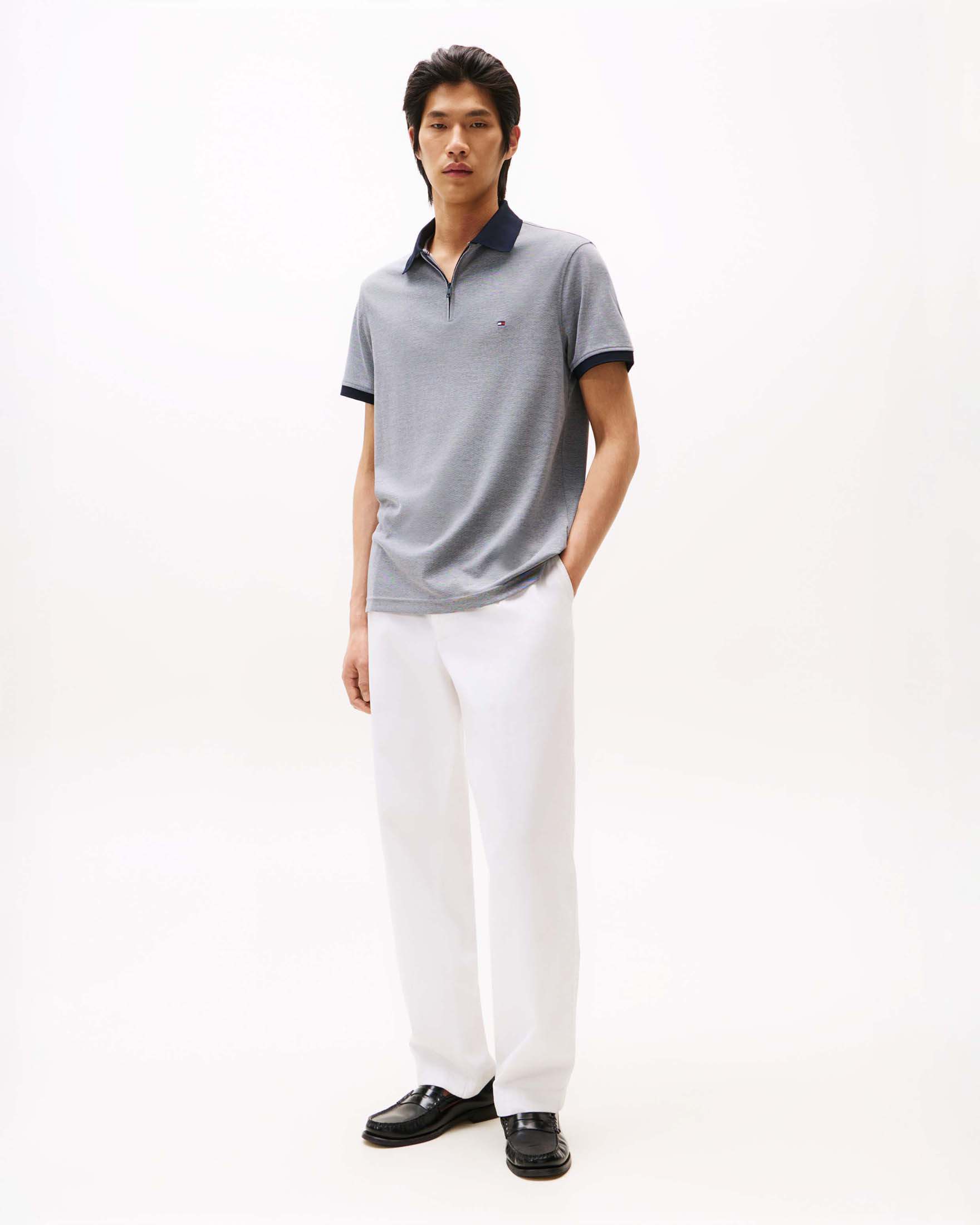 Tommy Hilfiger — Polo Tommy Hilfiger blu mélange in misto cotone con zip e logo ricamato