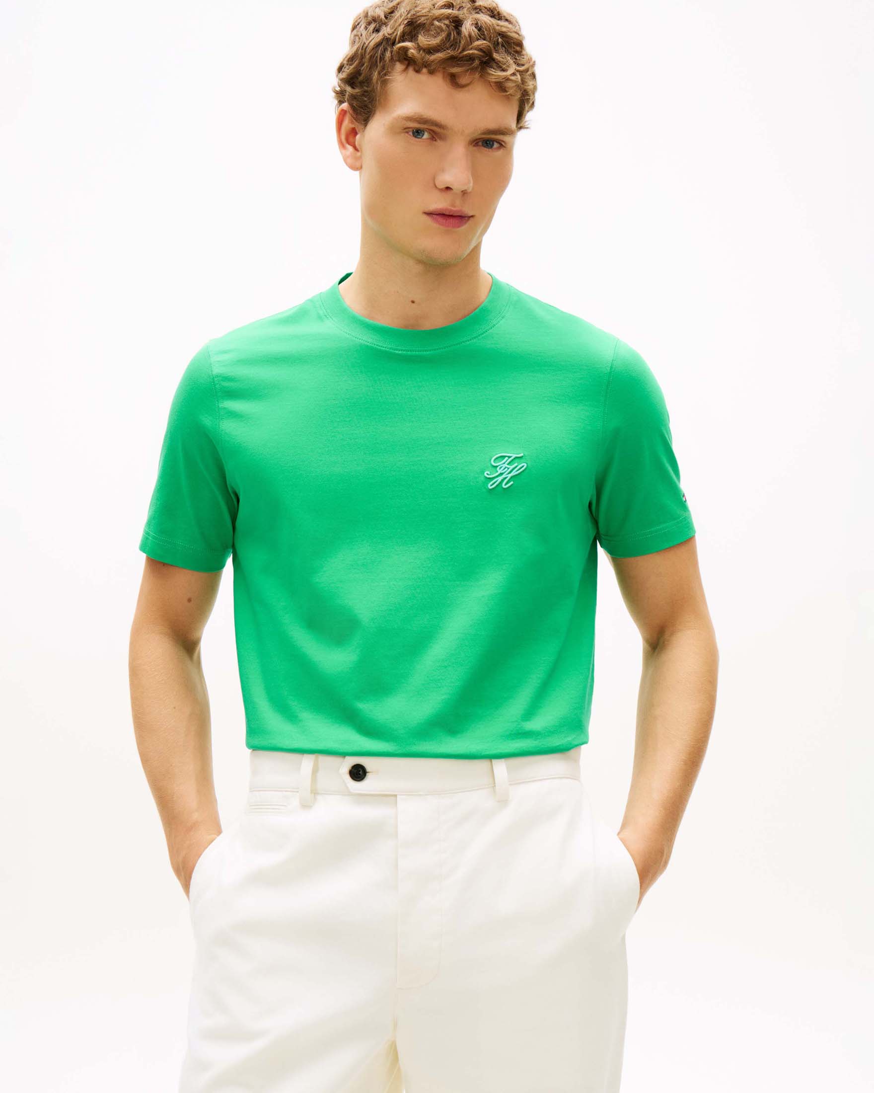 T-shirt Tommy Hilfiger verde in cotone con logo monogramma ricamato sul petto image