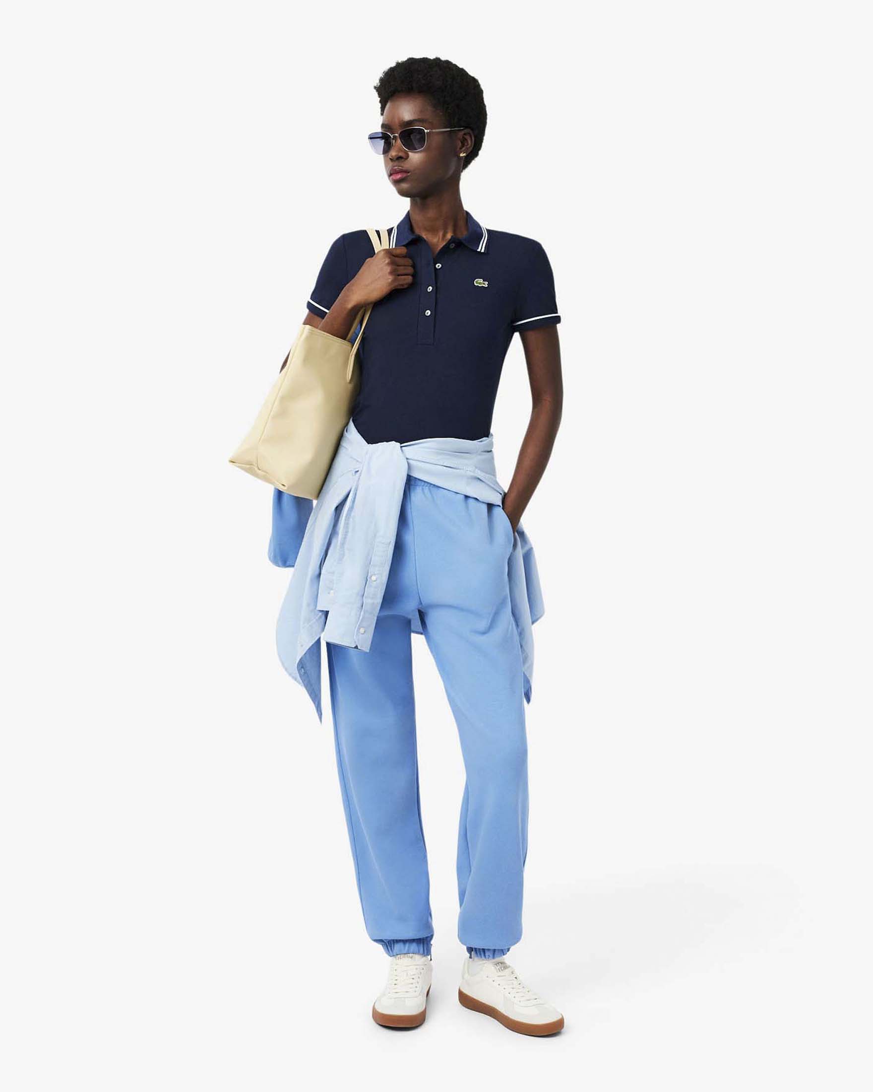 Polo slim-fit blu Lacoste con bordino azzurro e bianco in cotone elasticizzato