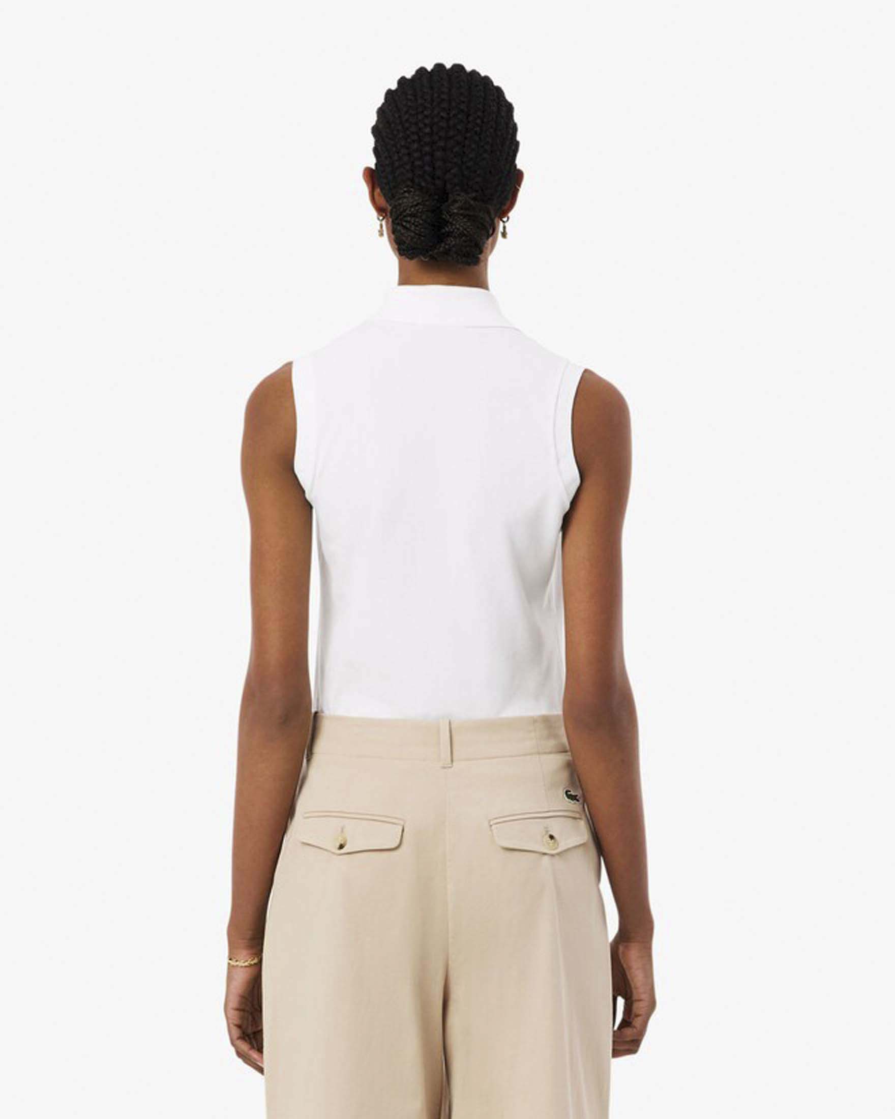 Polo bianca Lacoste senza maniche in piquè di cotone elasticizzato image