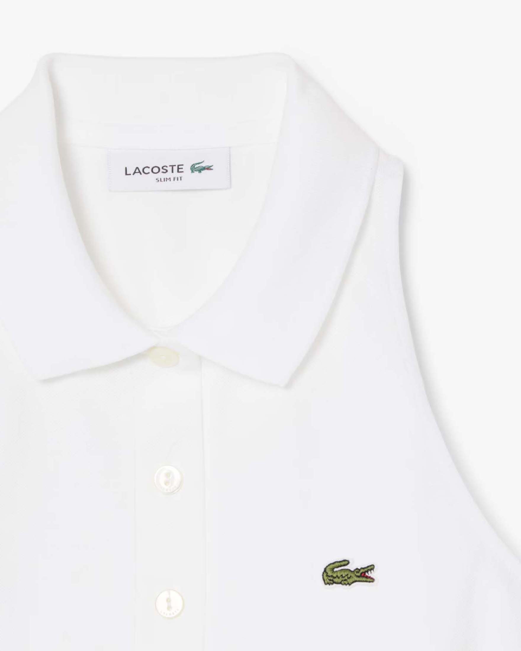 Polo cropped bianca senza maniche Lacoste in piquè di cotone elasticizzato image