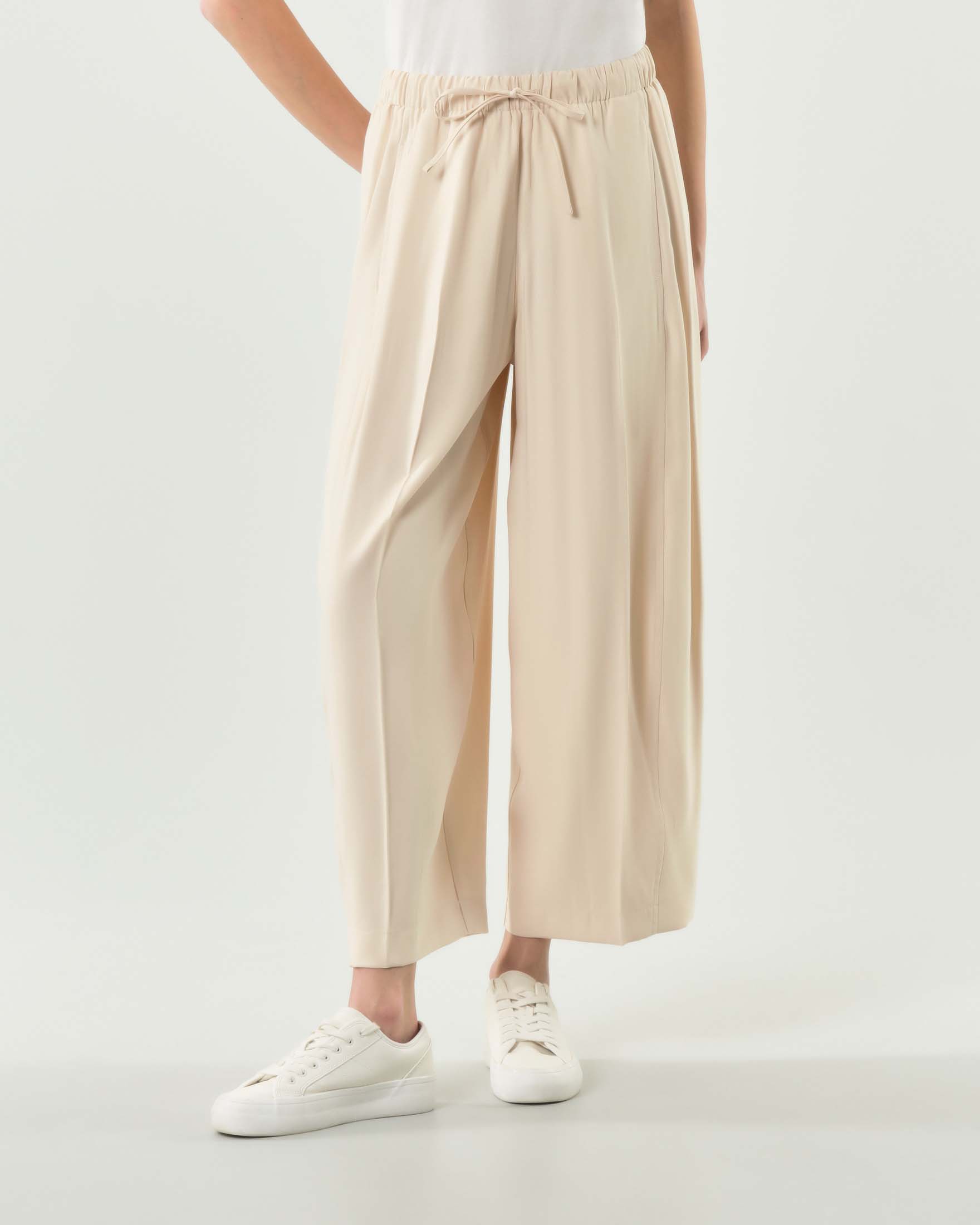 Pantaloni ampi color panna Rio Bonheur con elastico con fiocco in vita e piega stirata image