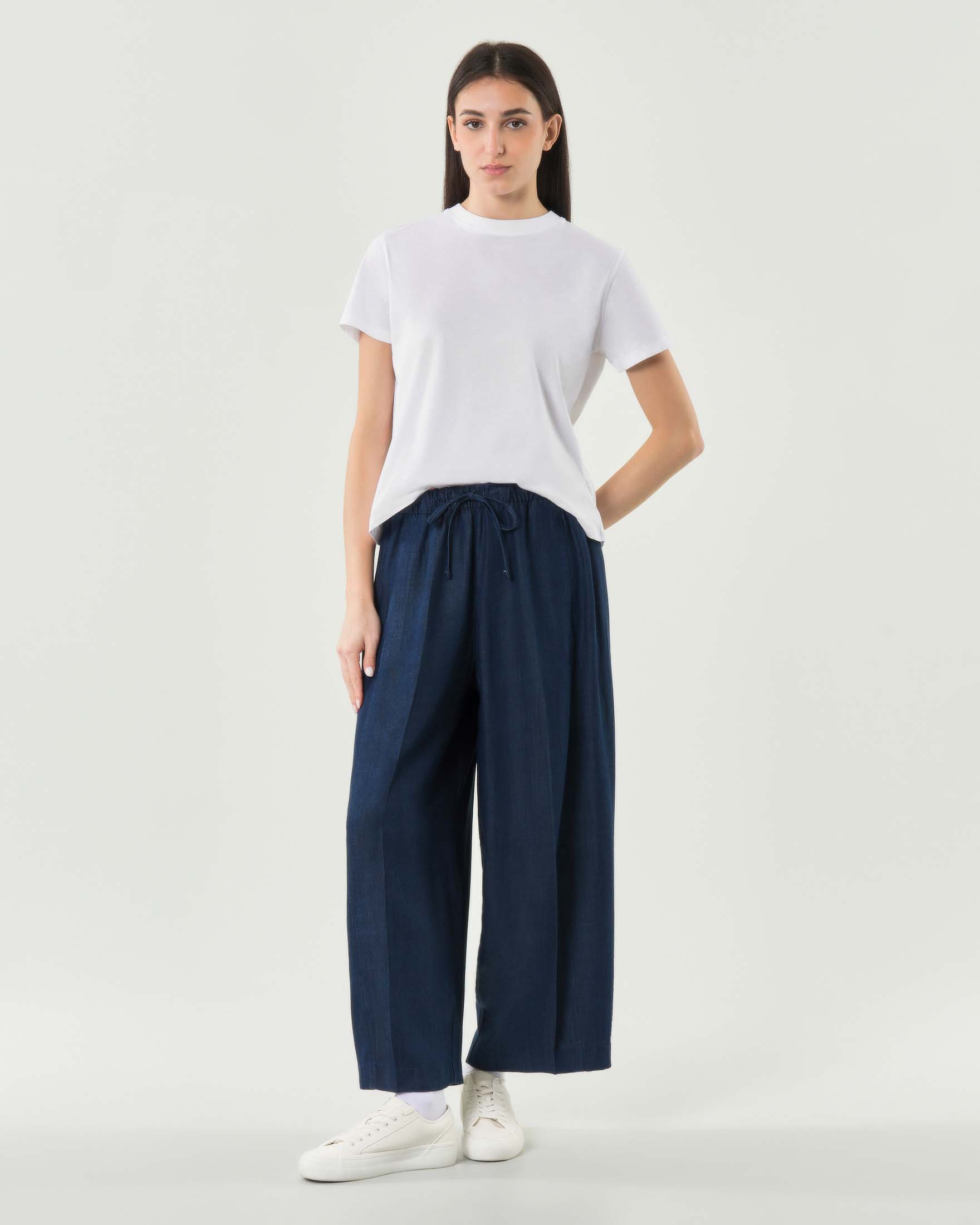 Pantaloni ampi blu Rio Bonheur con elastico con fiocco in vita e piega stirata