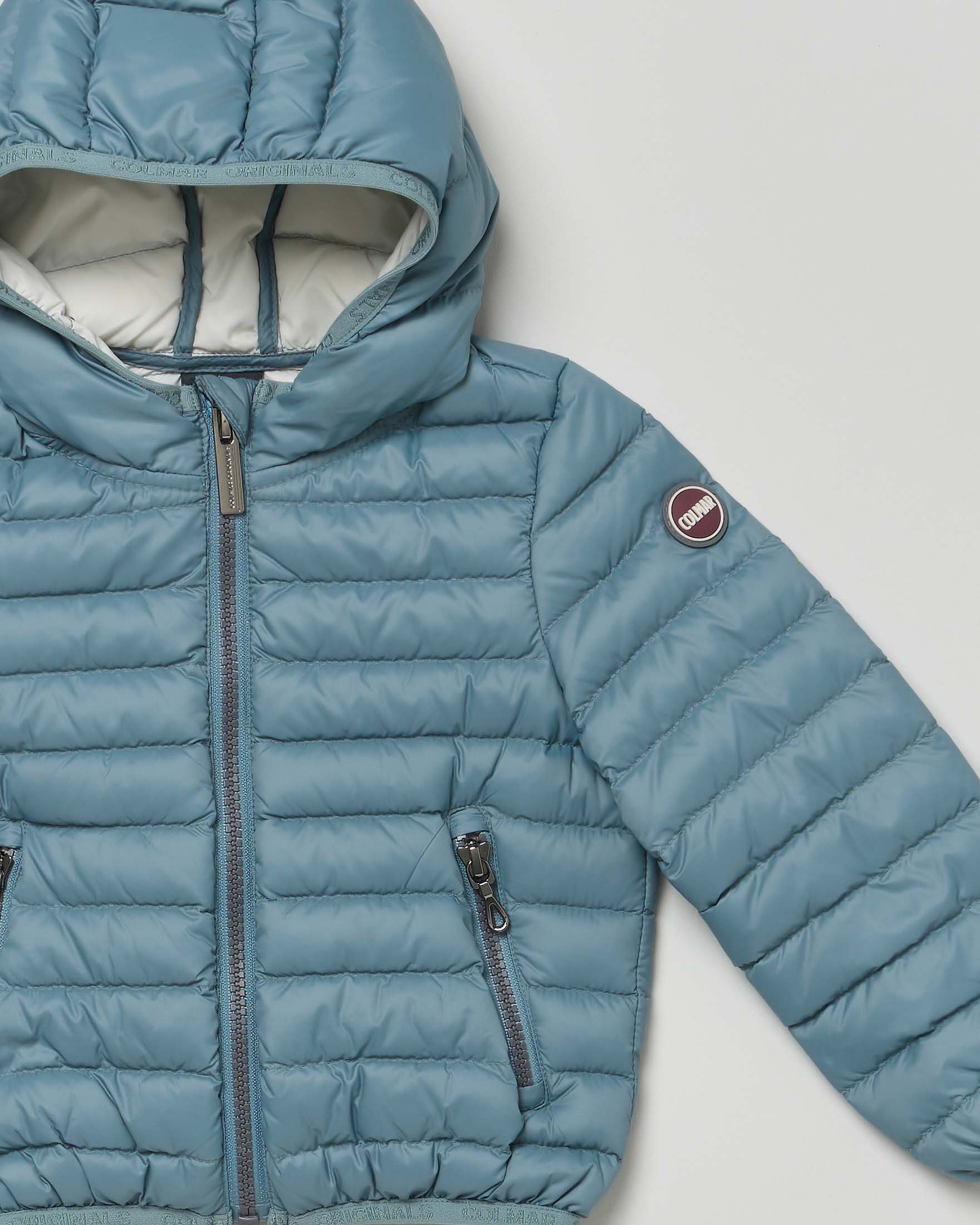 Piumino Colmar azzurro in nylon imbottito e trapuntato con cappuccio image