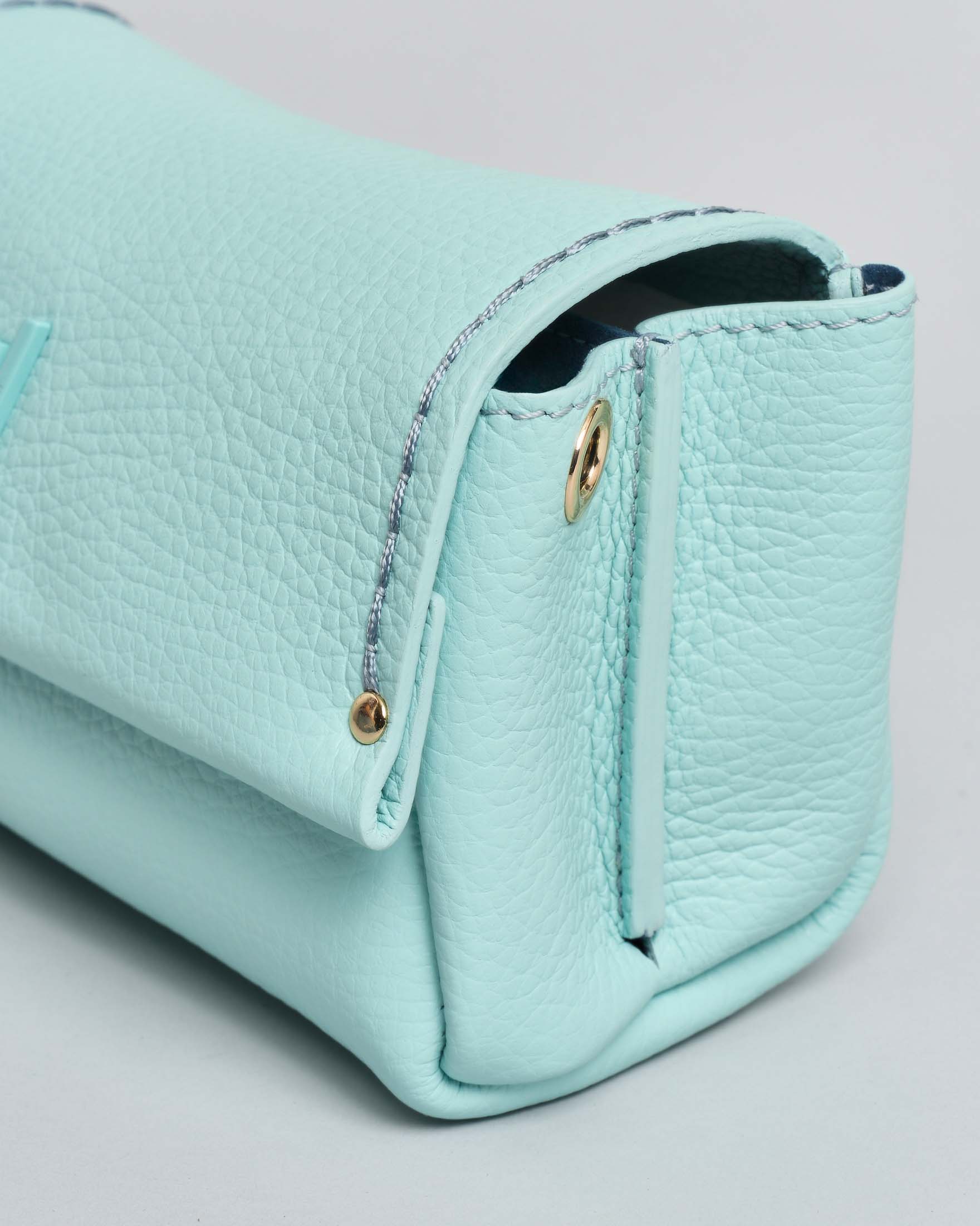 Mini Bag Visonà color acqua in pelle martellata con patta e tracolla removibile image