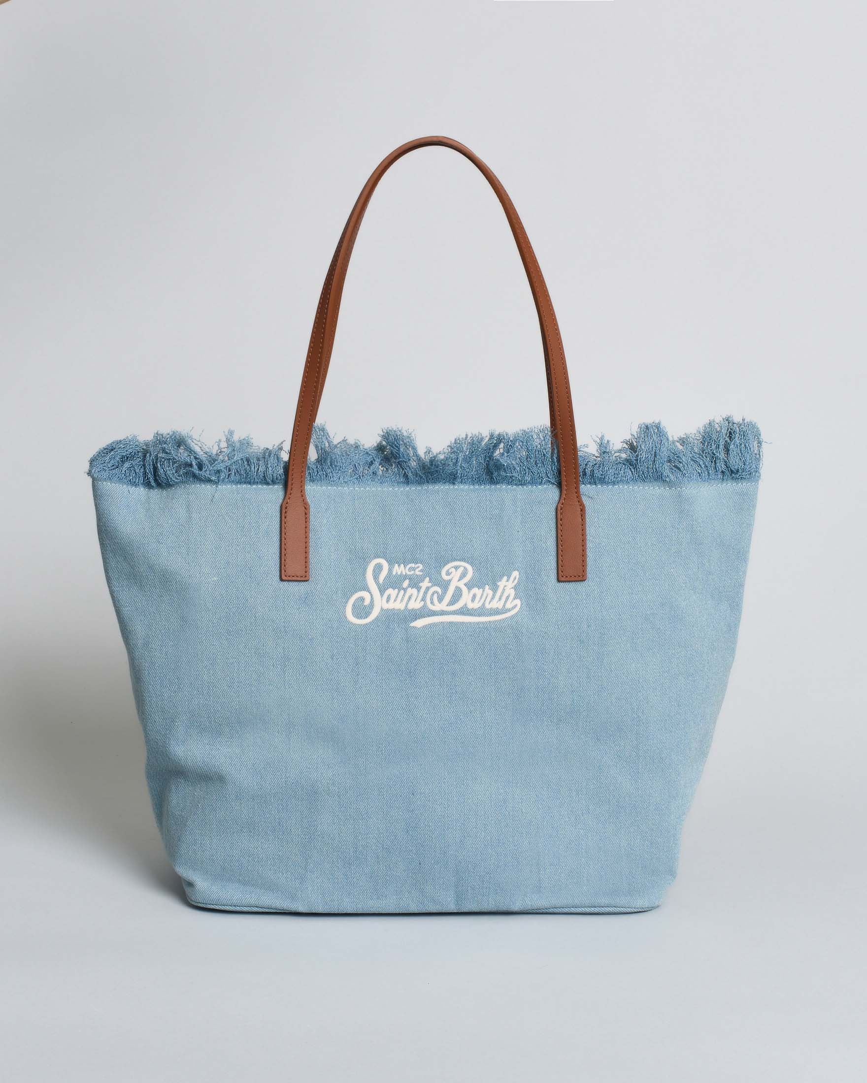 Borsa City Regular in denim di cotone blu chiaro con chiusura a zip e frange