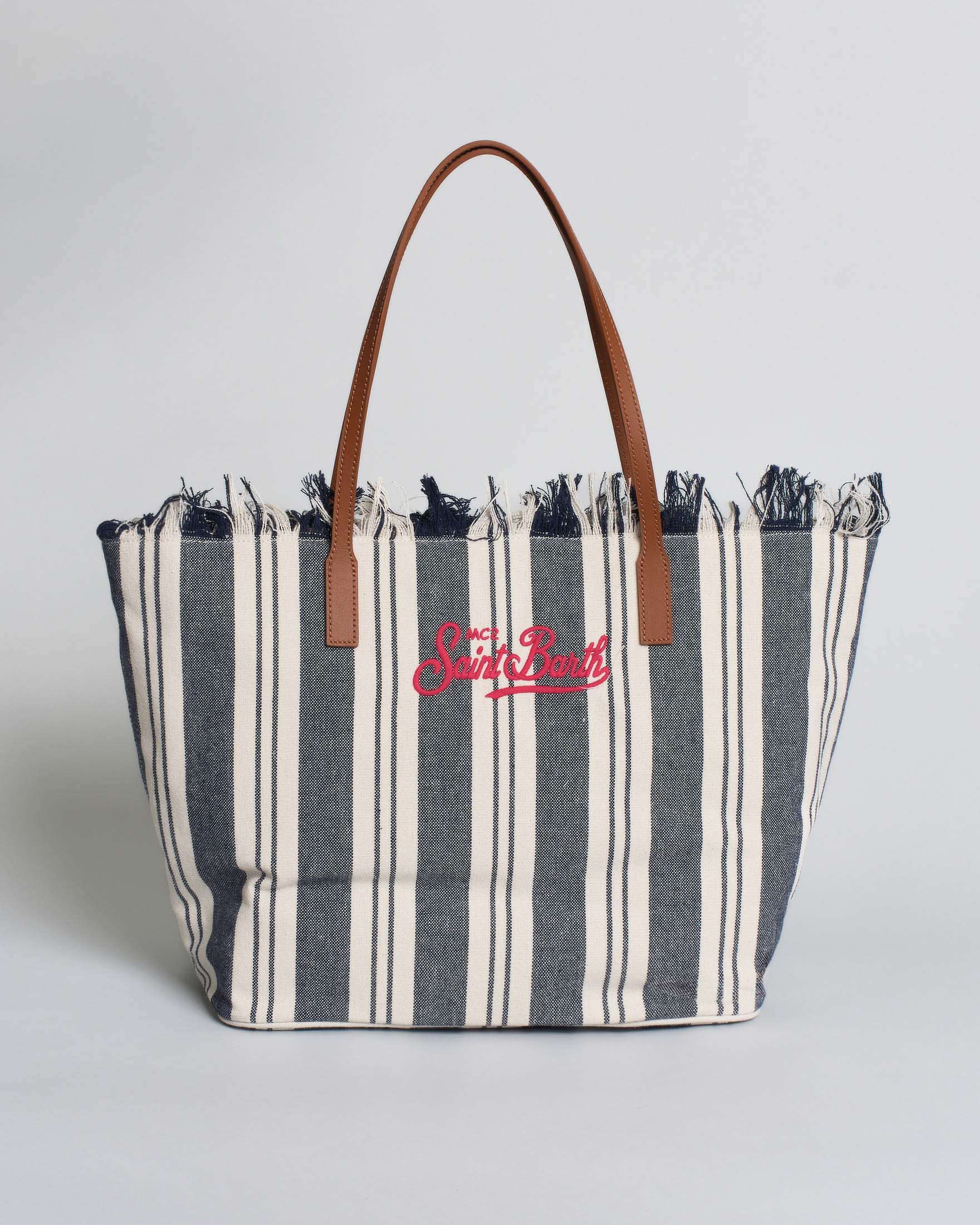 Borsa City Regular in canvas blu a righe bianche con chiusura a zip e frange