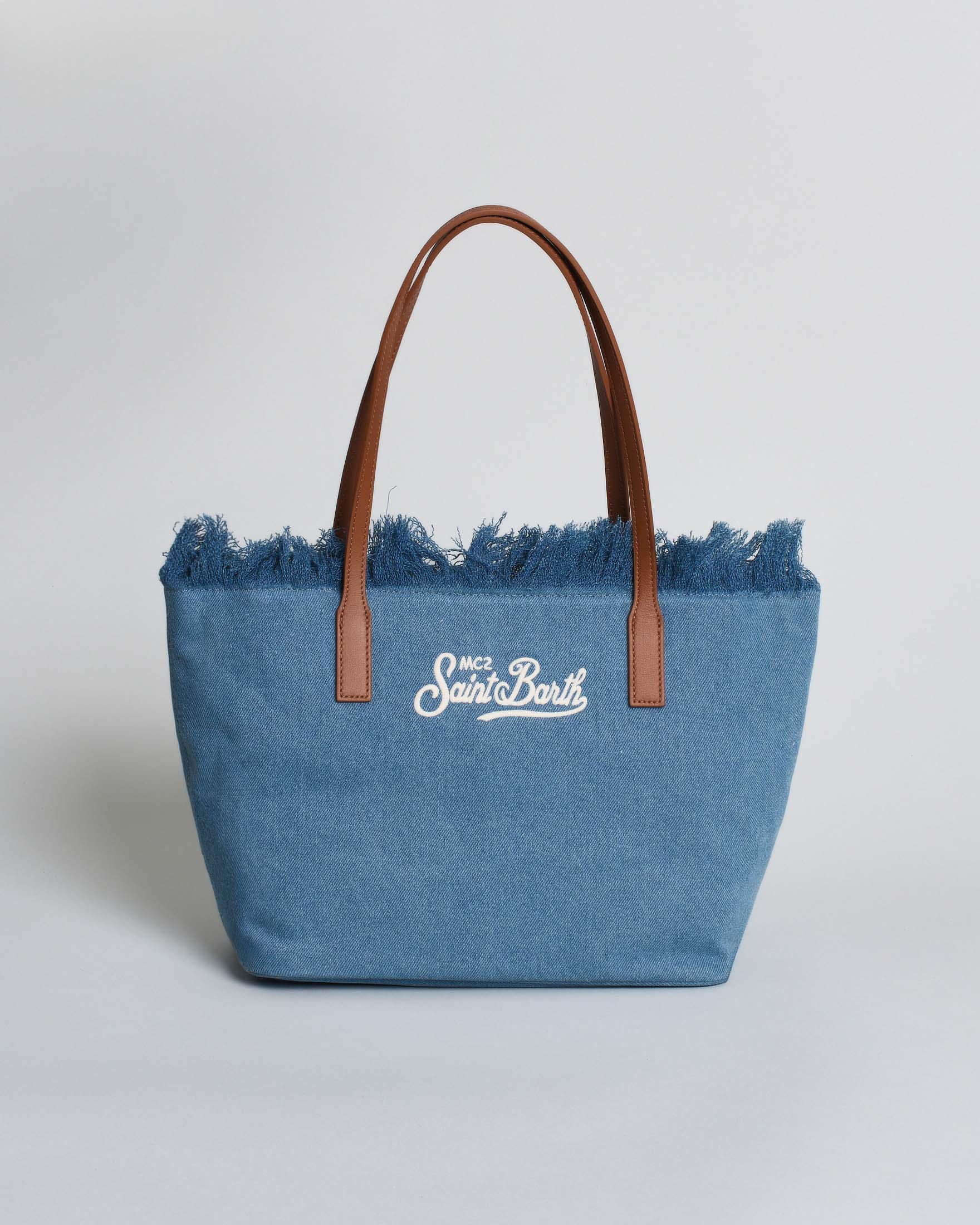 Borsa City Medium in denim blu con chiusura a zip e frange