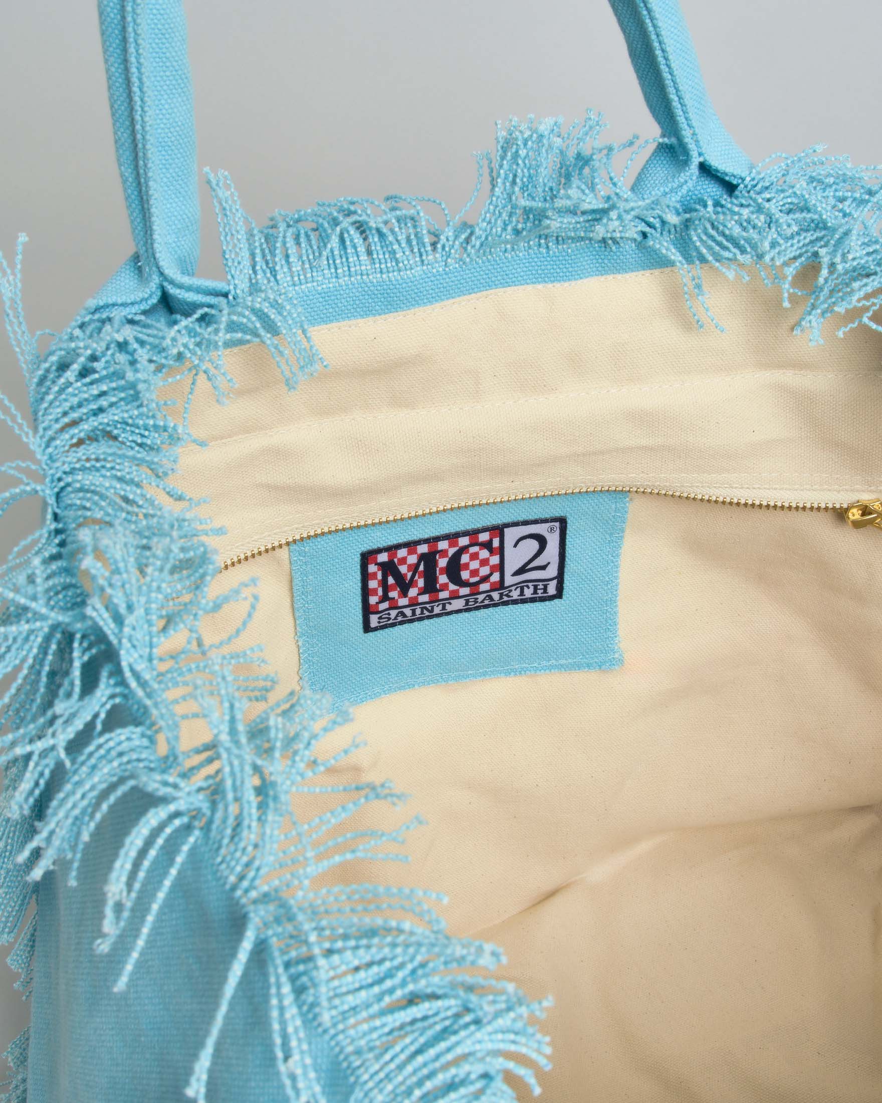 Borsa Vanity MC2 Saint Barth azzurra in cotone con scritta logo stampata bianca e orli sfrangiati image