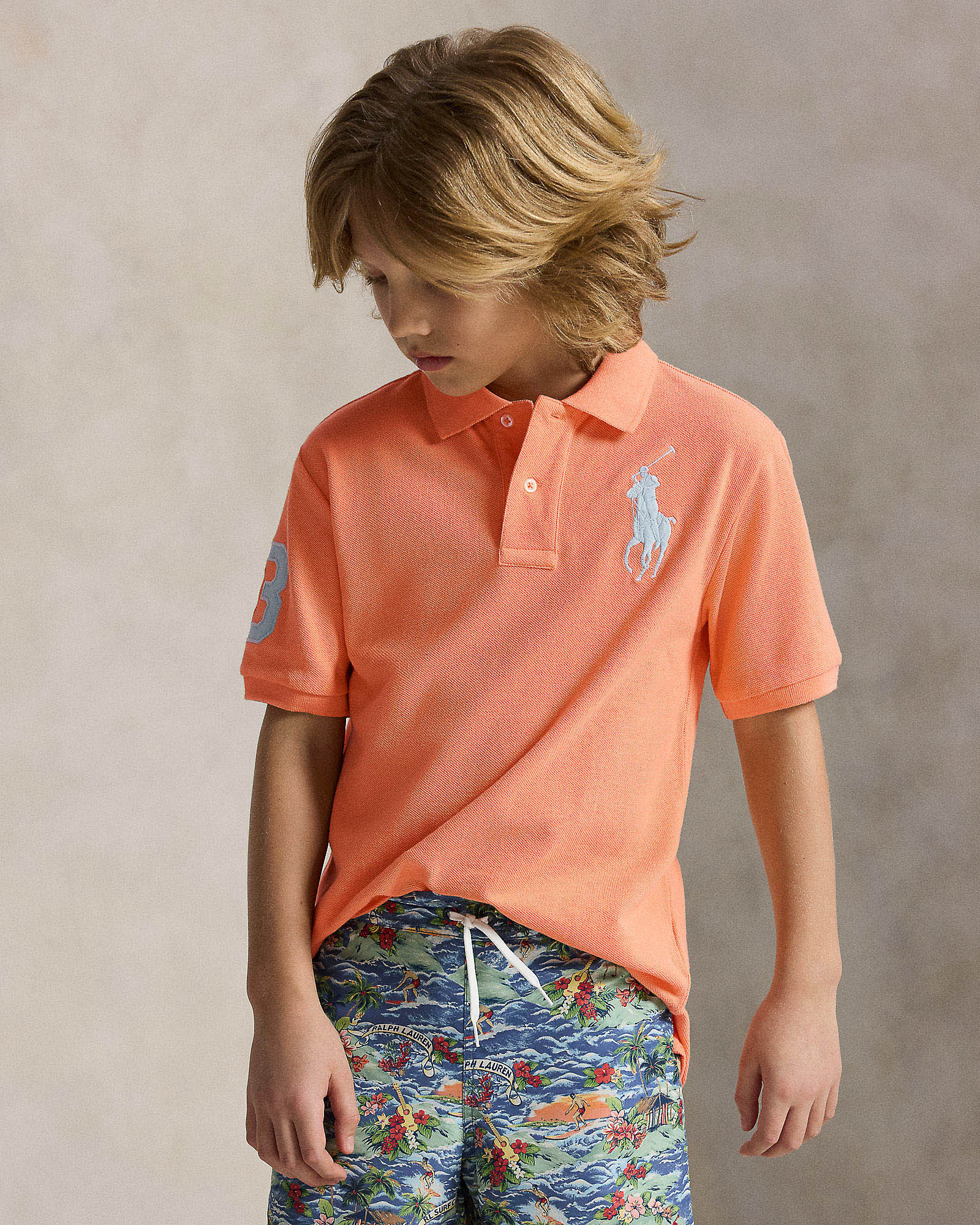 Polo arancione a maniche corte in cotone con maxi logo pony verde acqua