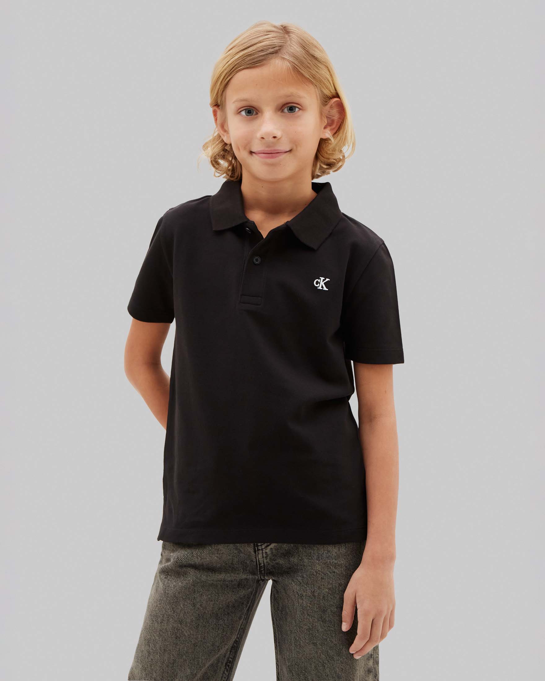 Polo mezza manica nera Calvin Klein in cotone stretch con logo bianco