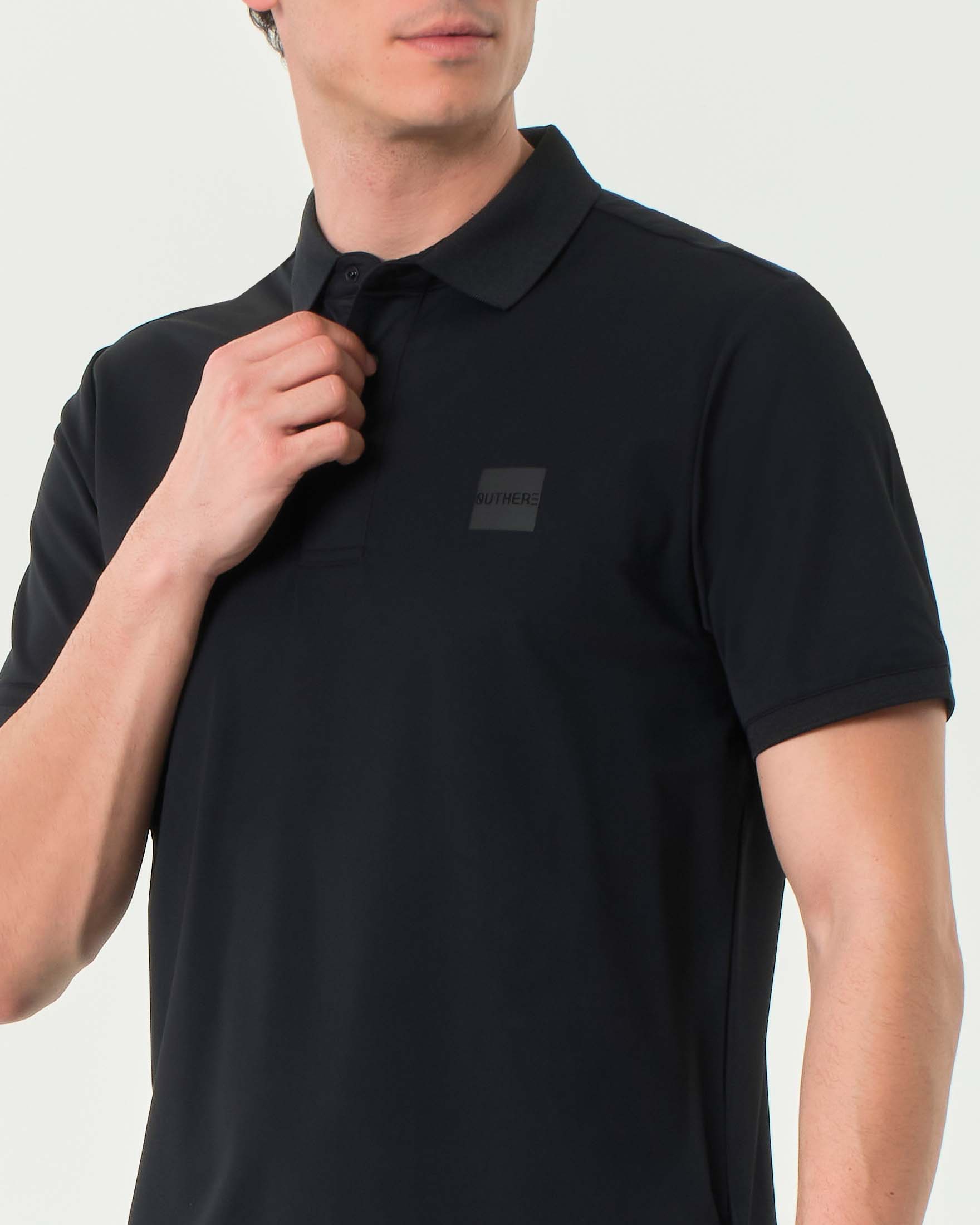 Polo Outhere nera in tessuto tecnico di micro piquè stretch image