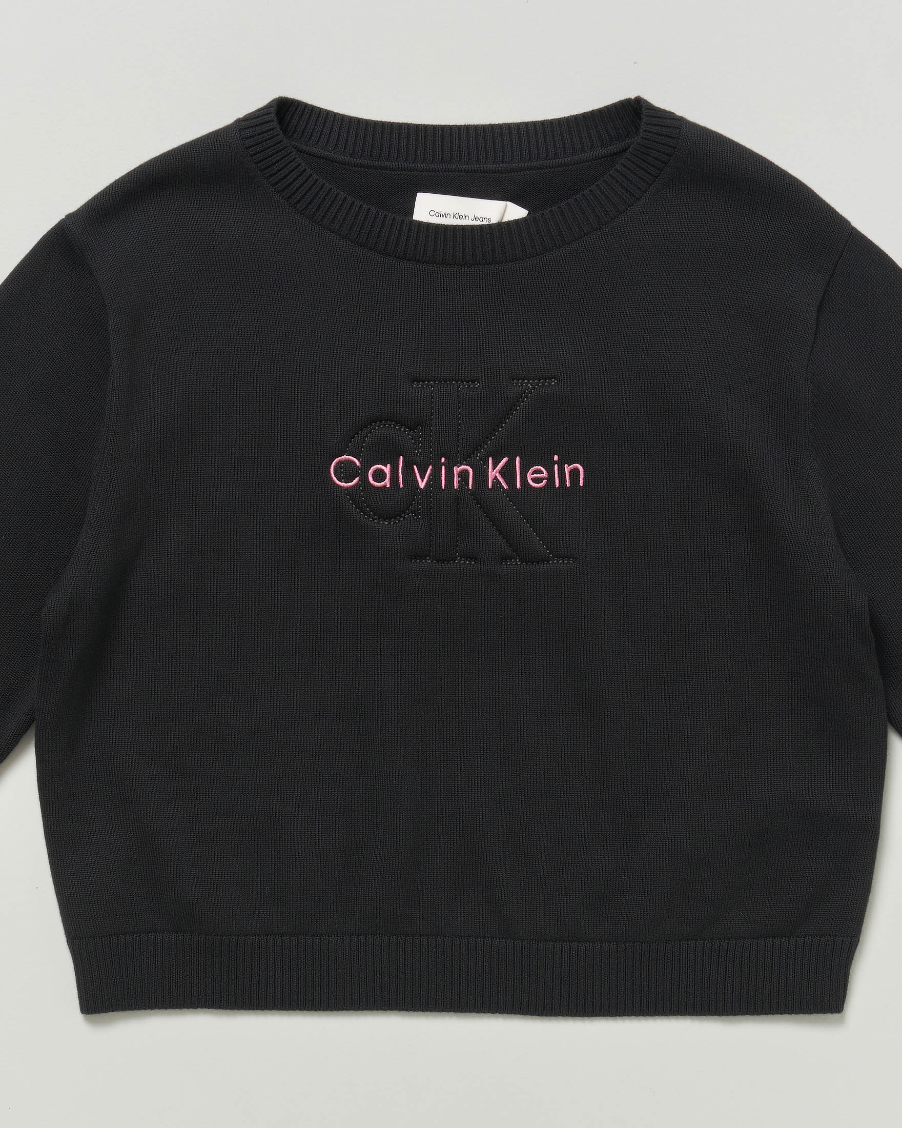 Maglia nera Calvin Klein in cotone tricot con scritta logo rosa image