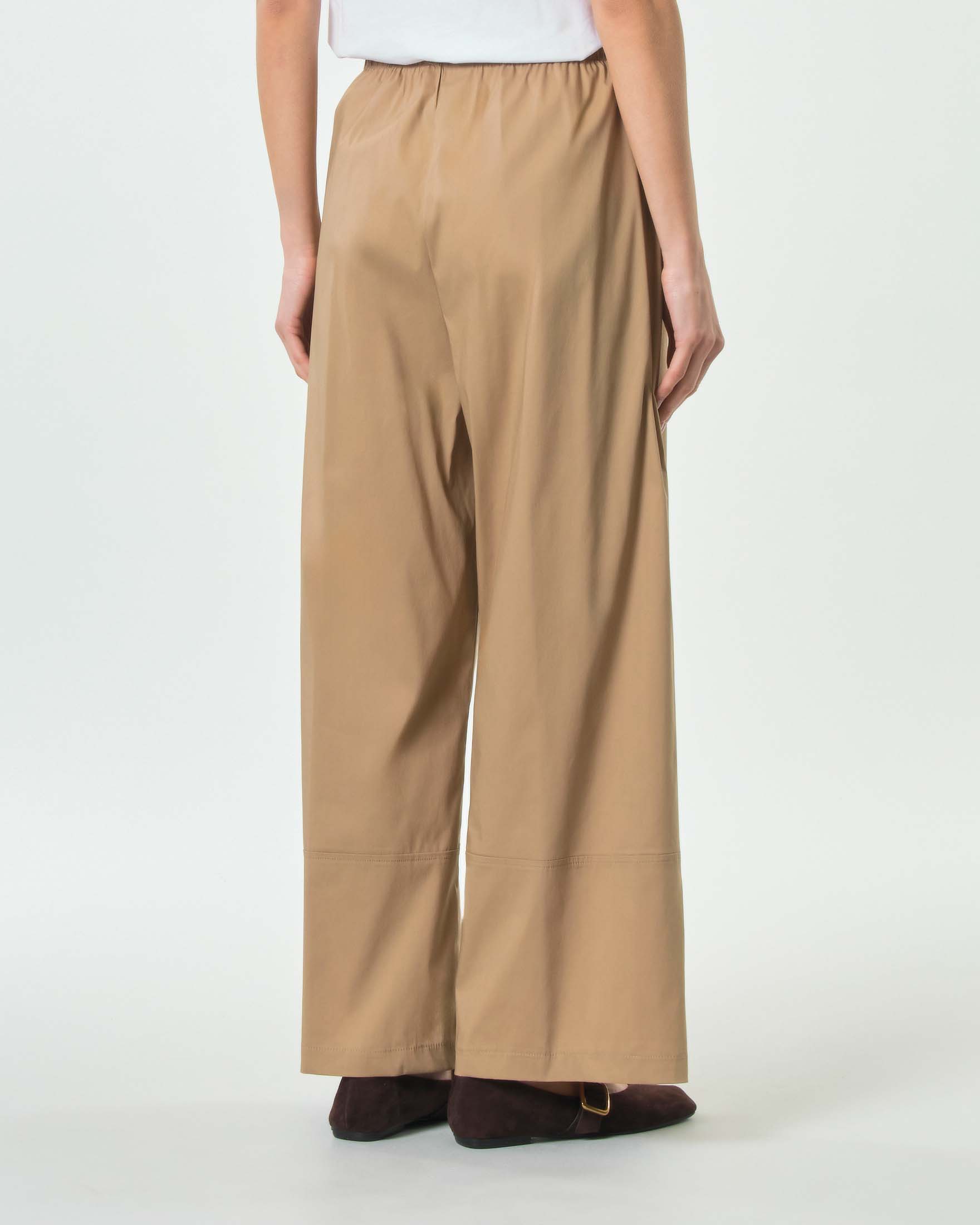 Pantaloni beige Jurerê in popeline di cotone stretch dalla linea wide con elastico in vita