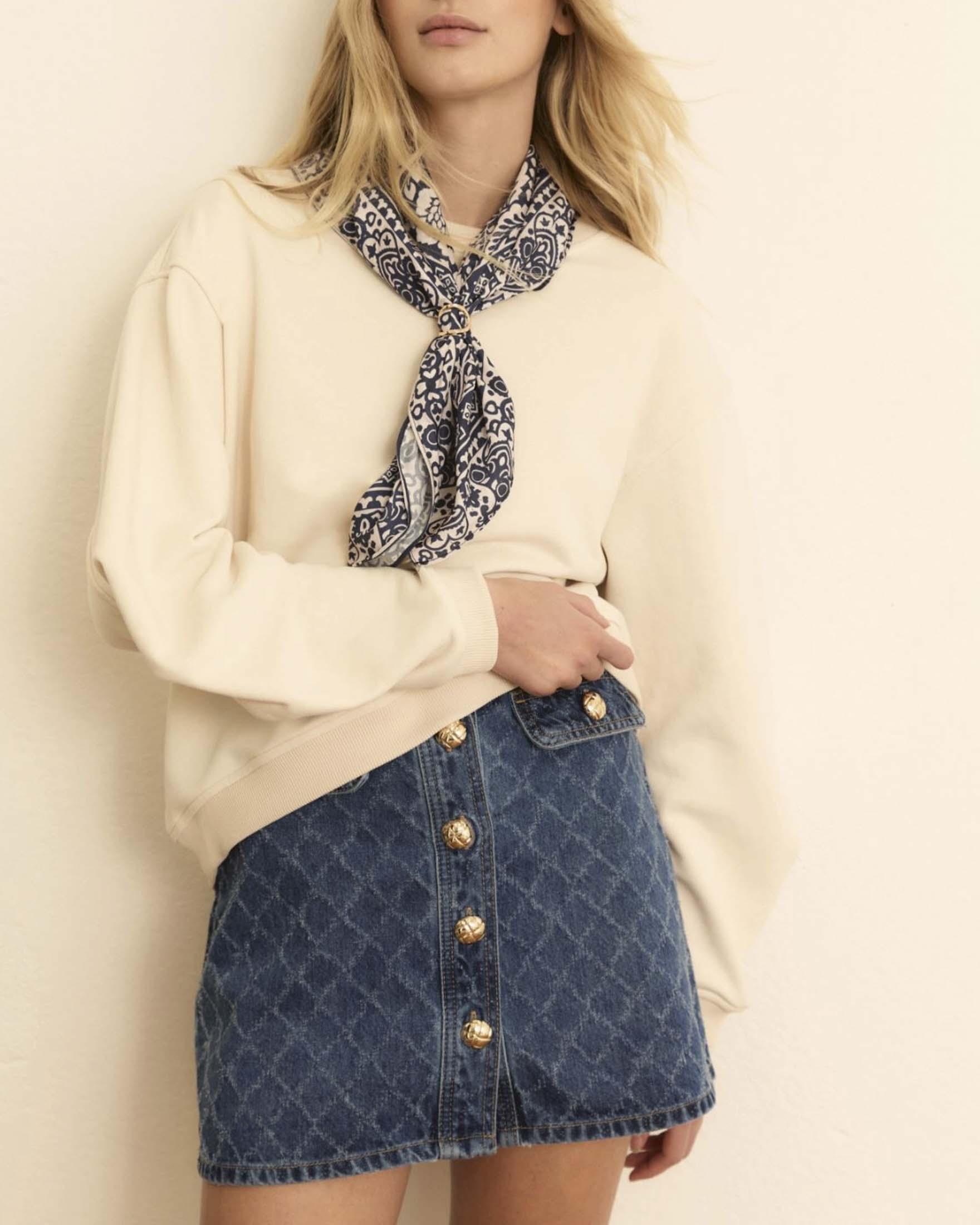 Mini gonna Emme Marella in denim di cotone con bottoni bijoux e laserature a rombi image