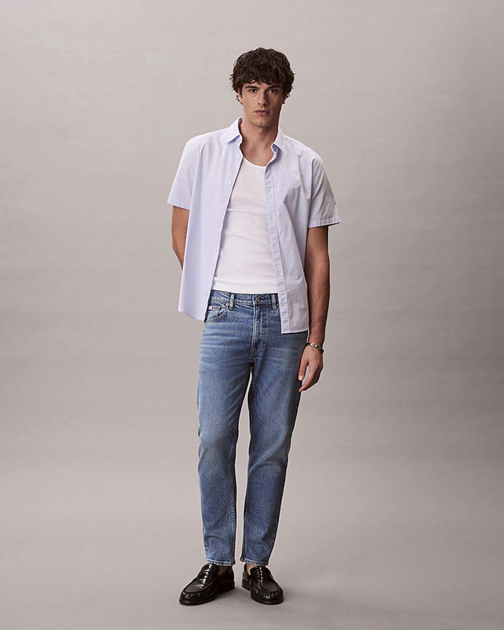 Jeans tapered Jeans lavaggio chiaro in misto cotone elasticizzato