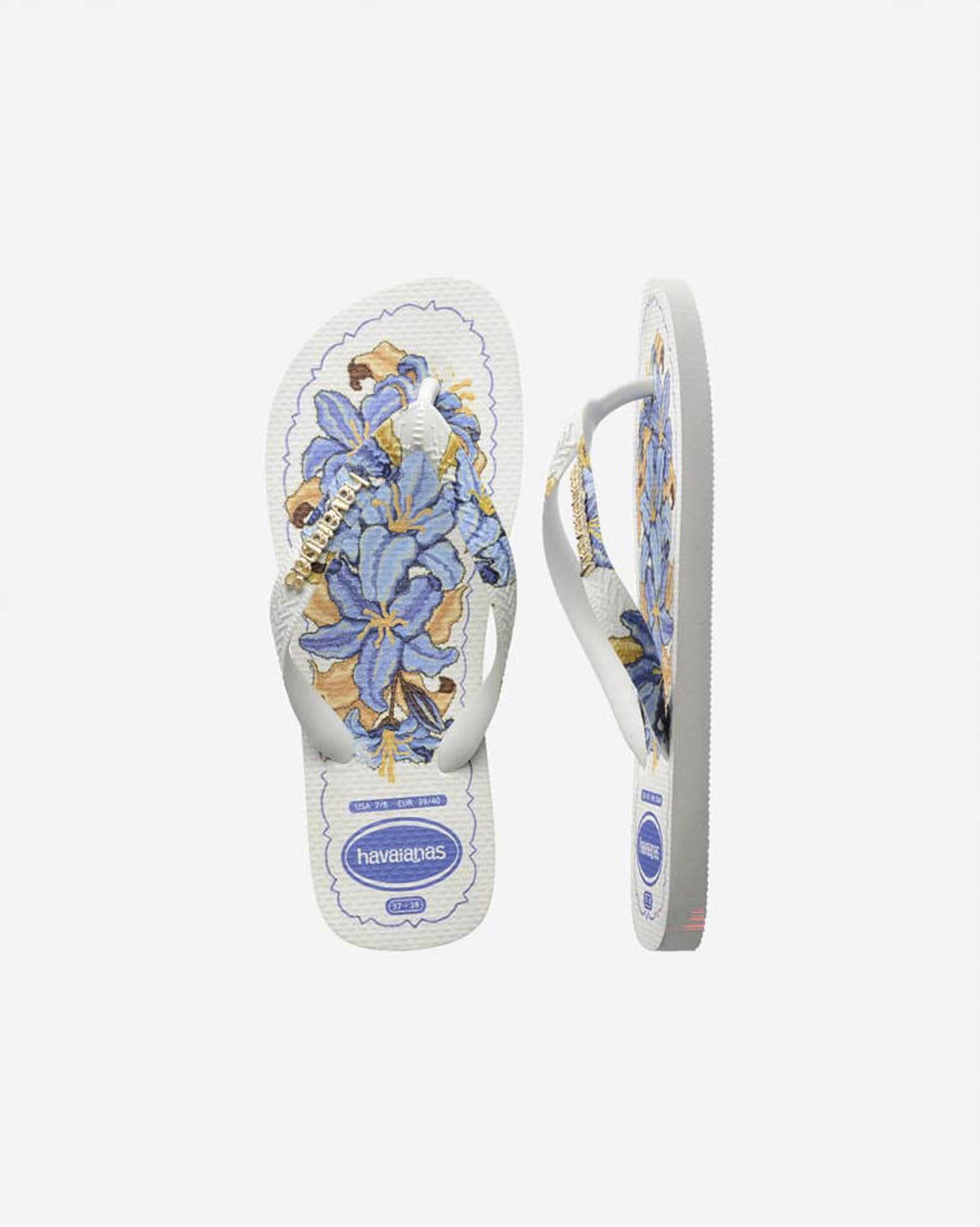 Ciabatte infradito Top Tropicalia Vibes II Havaianas bianche con stampa a fiori azzurra e logo dorato