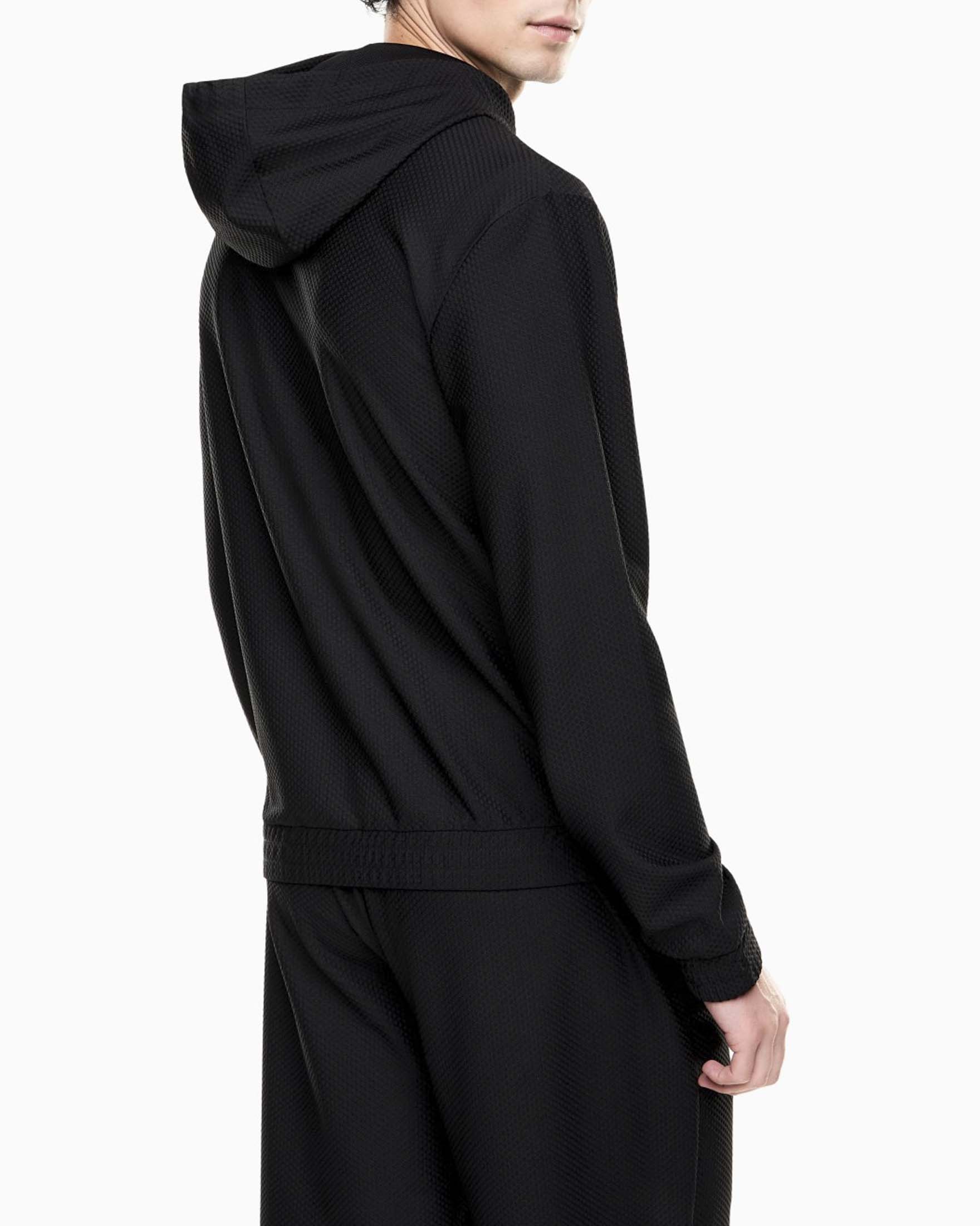 Felpa EA7 nera in tessuto elasticizzato con cappuccio e zip image