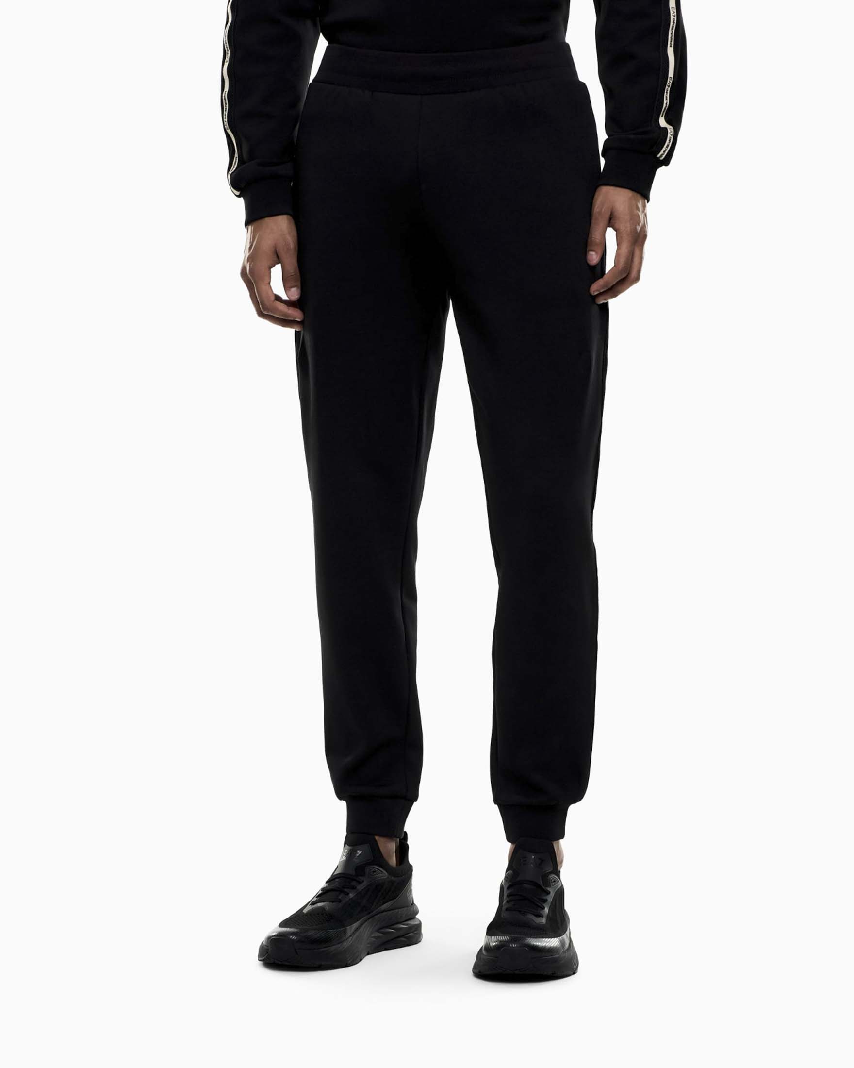 Pantaloni jogger EA7 neri in misto cotone con banda laterale logata