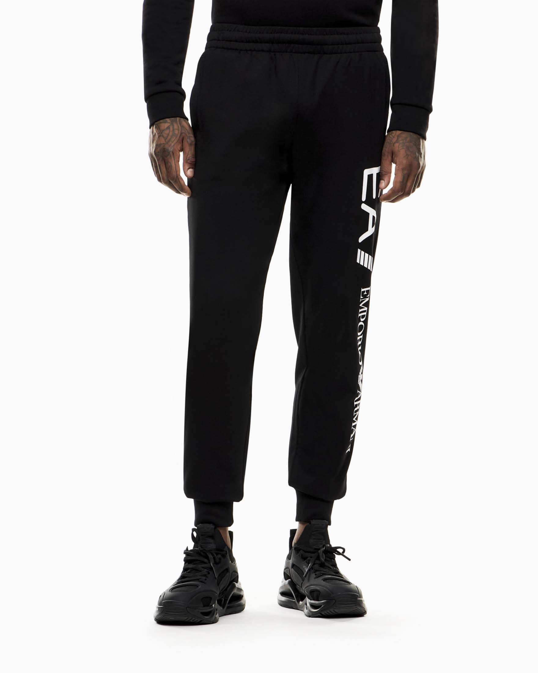 Pantaloni neri in cotone con maxi logo laterale stampato
