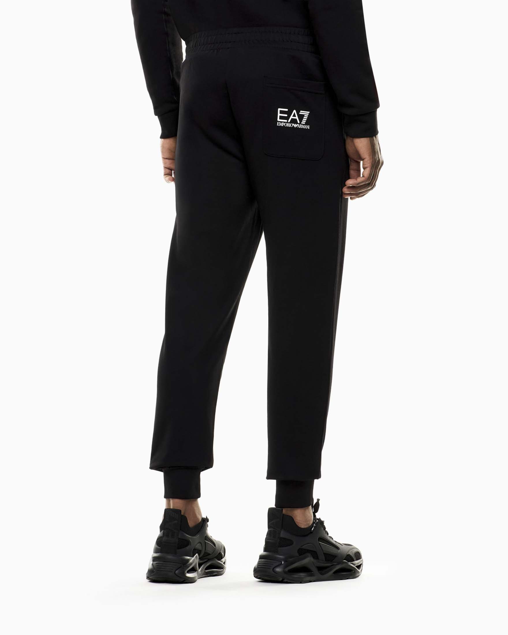 Pantaloni EA7 neri in cotone con maxi logo laterale stampato image