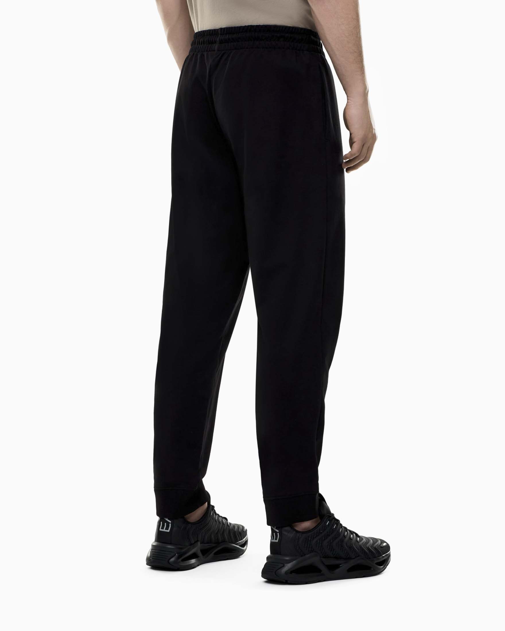 Pantaloni jogger EA7 neri in cotone con stampa logo image
