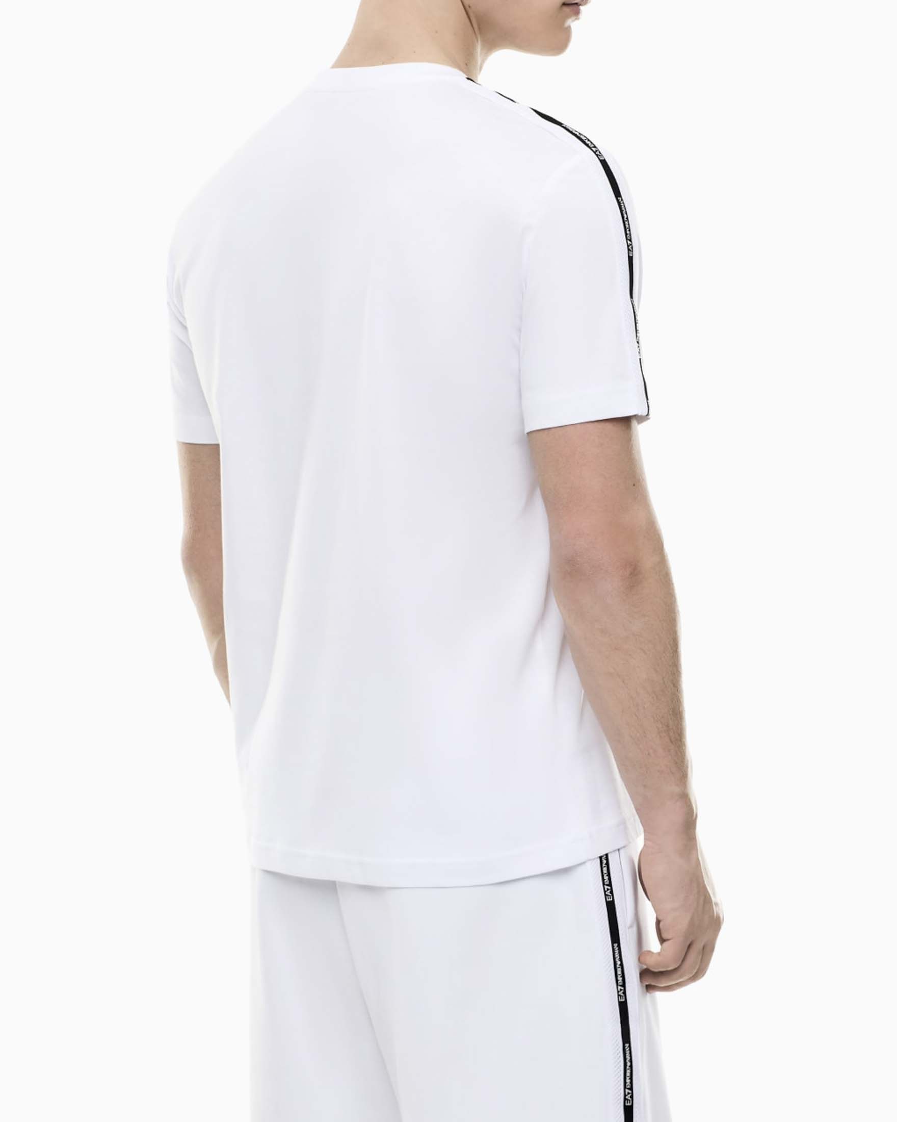 T-shirt mezza manica EA7 bianca in cotone con logo e bande image