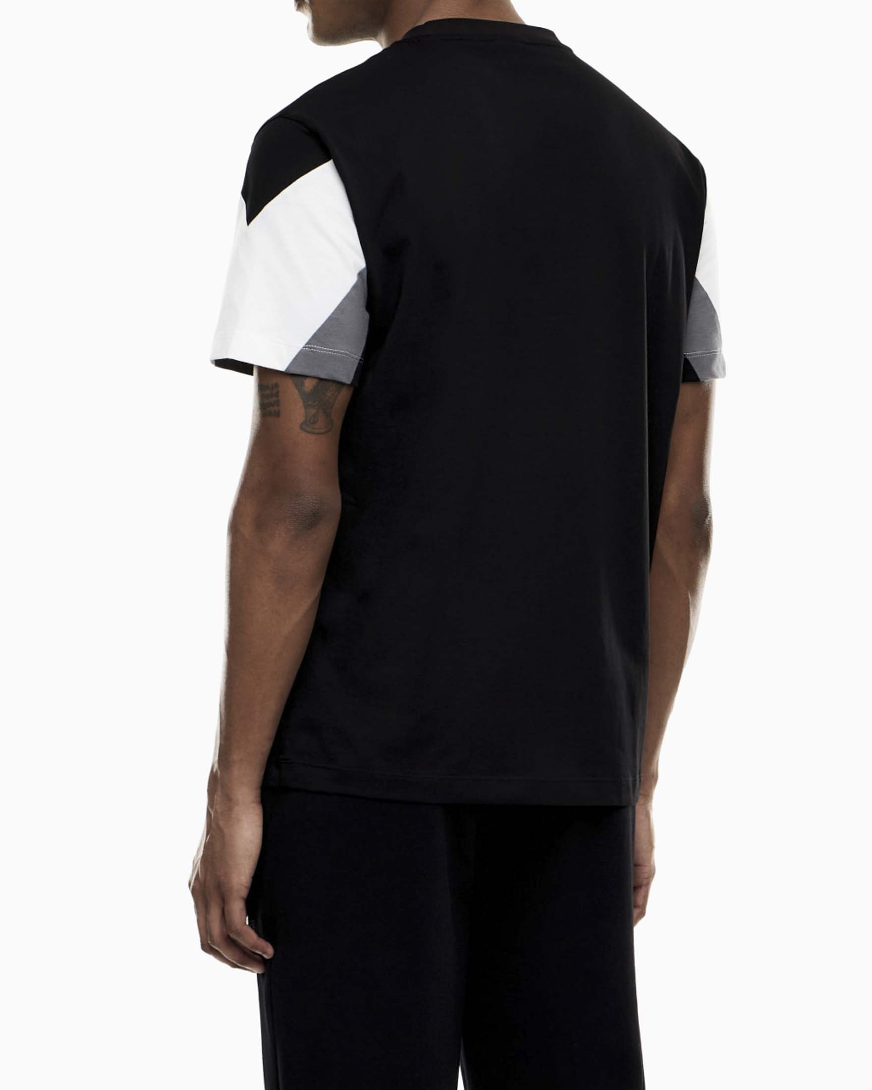 T-shirt mezza manica EA7 nera in cotone con inserto bianco e grigio image