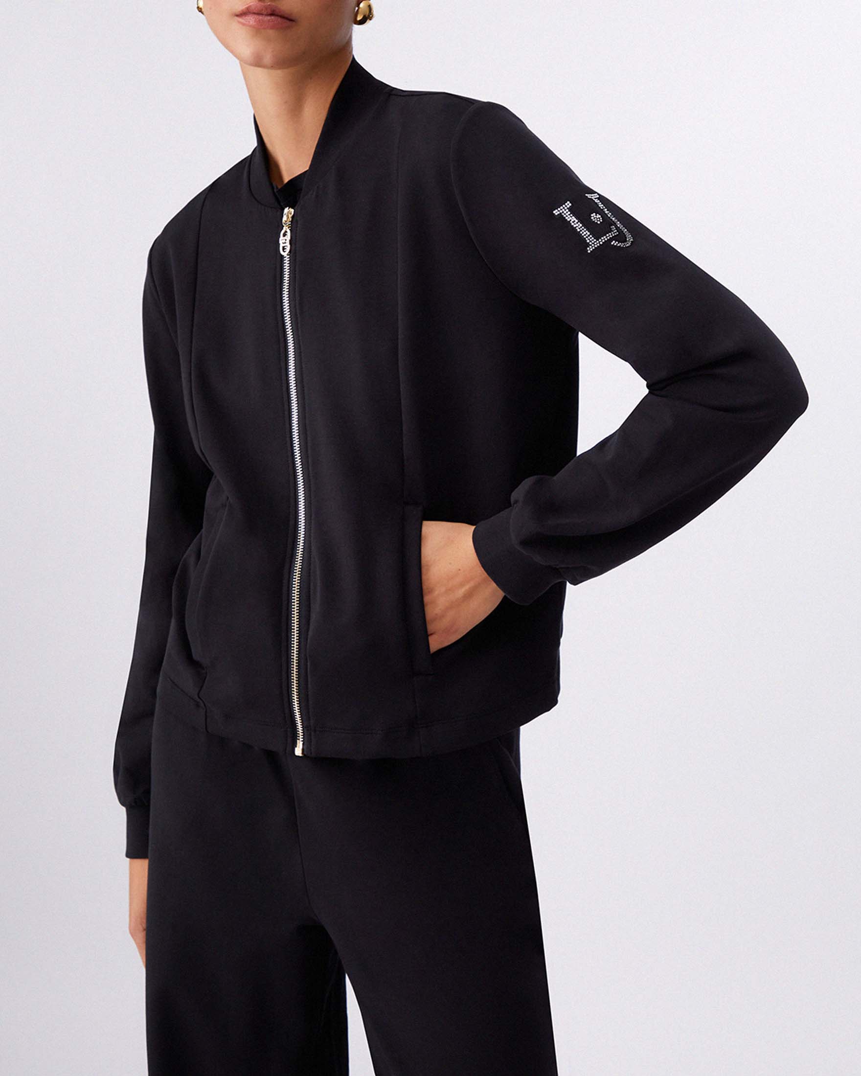 Completo felpa con zip e pantaloni flare Liu Jo Sport nero in jersey di cotone con logo strass image