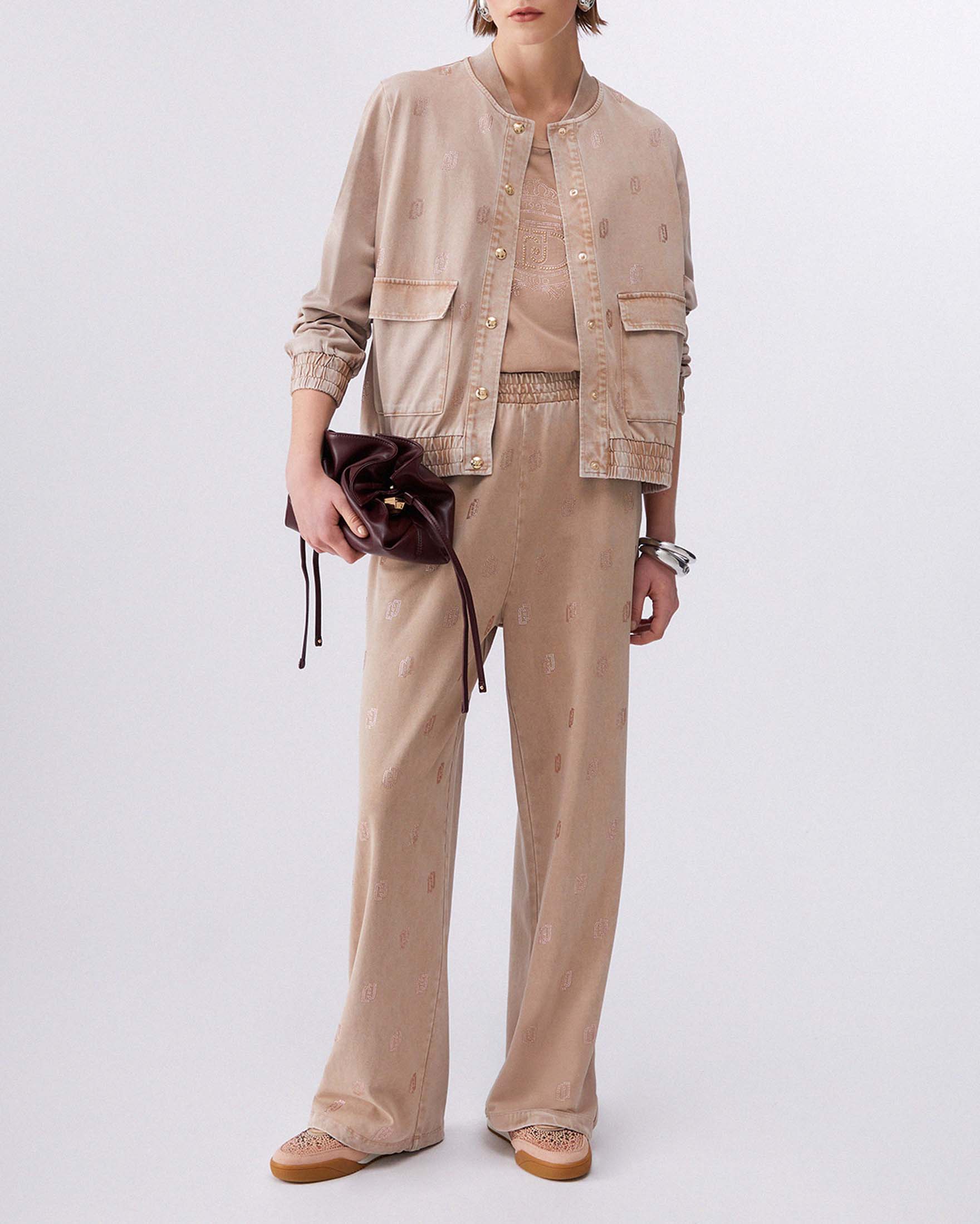 Pantaloni wide Liu Jo Sport color nude in jersey délavé con logo strass all over