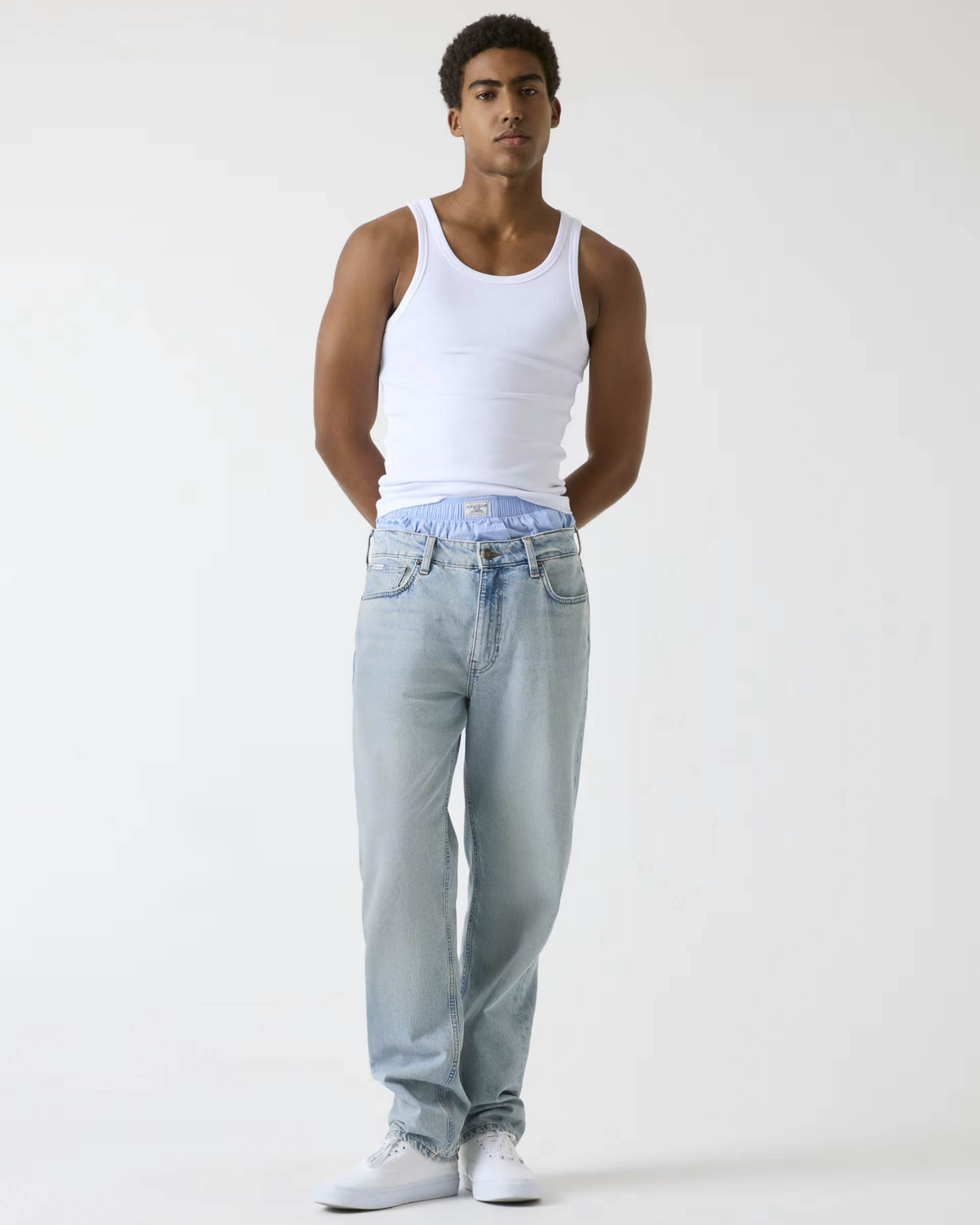 Jeans tapered-fit lavaggio chiaro in cotone stretch
