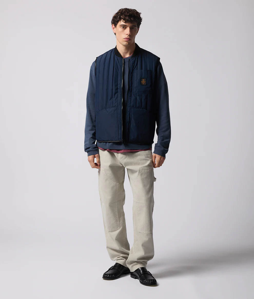 Gilet blu trapuntato con logo ricamato sul taschino