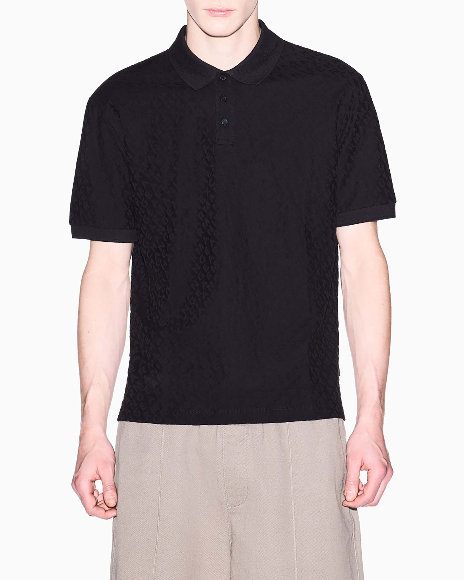 Polo Exchange nera in cotone con logo tono su tono jacquard