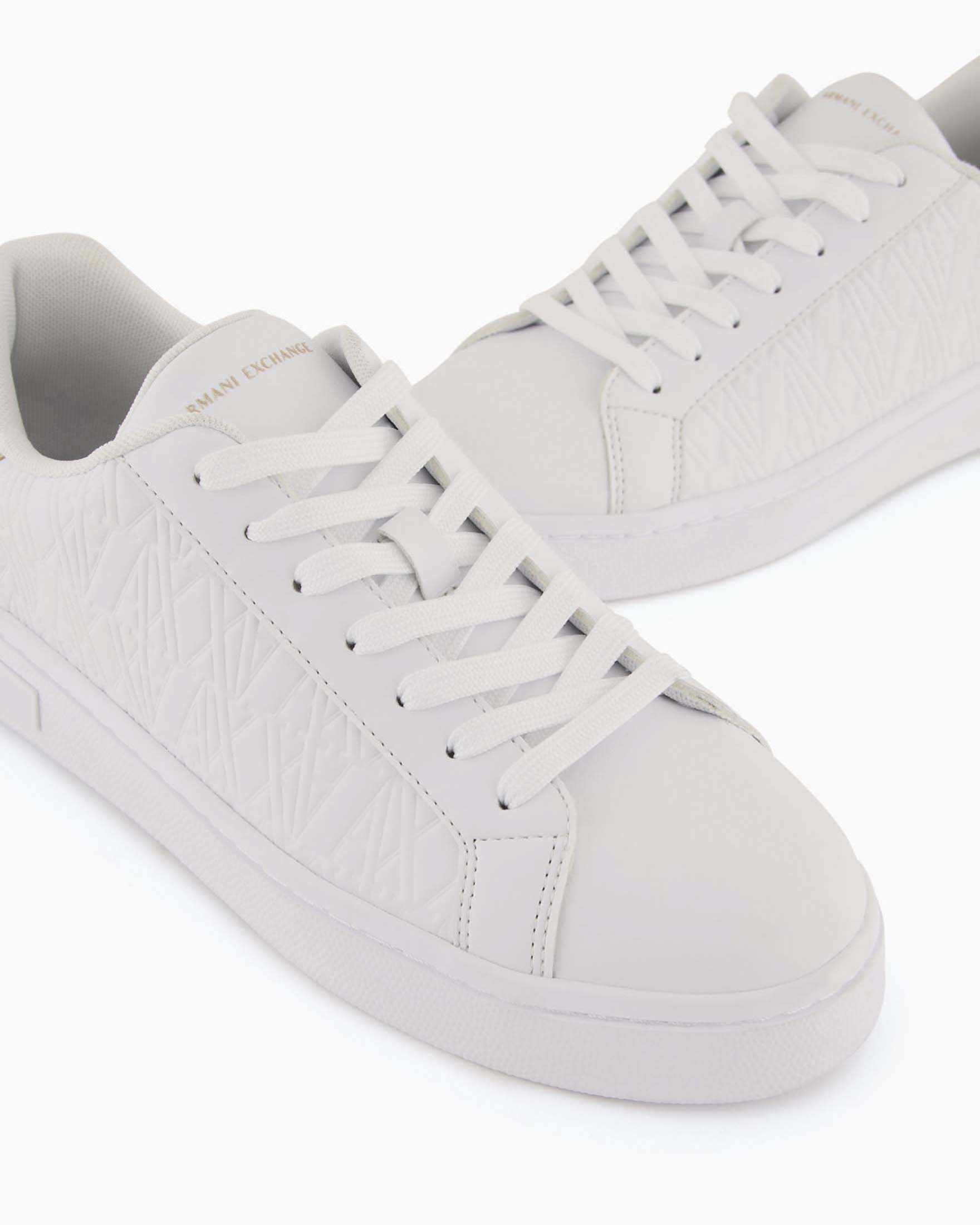Sneakers Platform Armani Exchange nere in similpelle con logo all over e inserto dorato sul retro