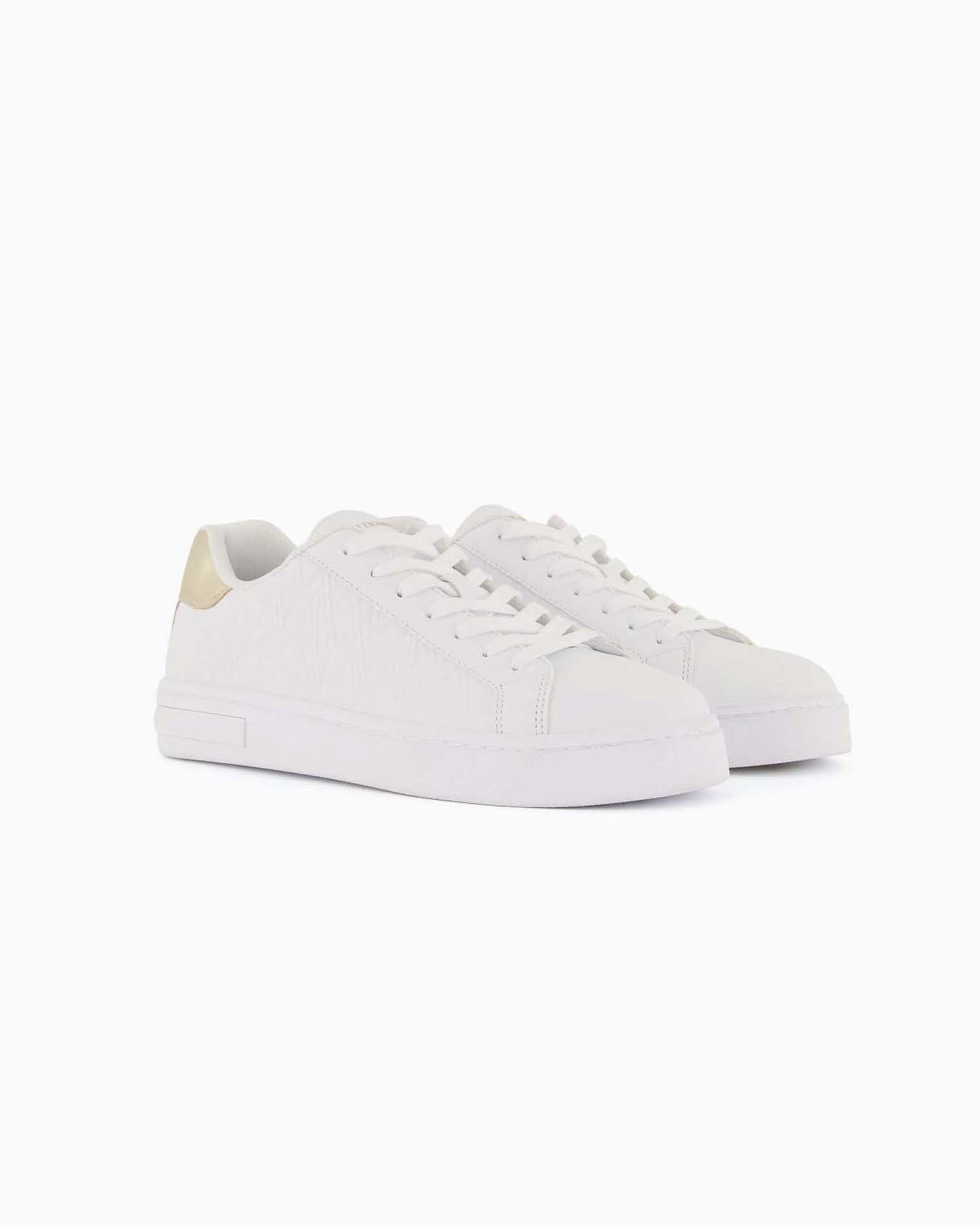 Sneakers Platform Armani Exchange nere in similpelle con logo all over e inserto dorato sul retro