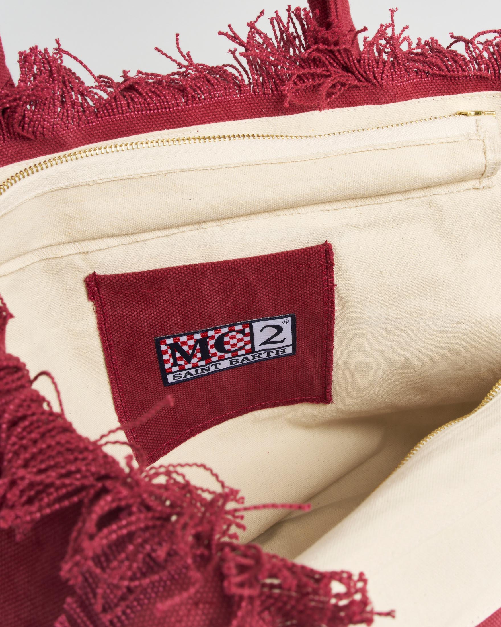Borsa Vanity Regular MC2 Saint Barth in denim di cotone bordeaux con scritto logo patch e frange image