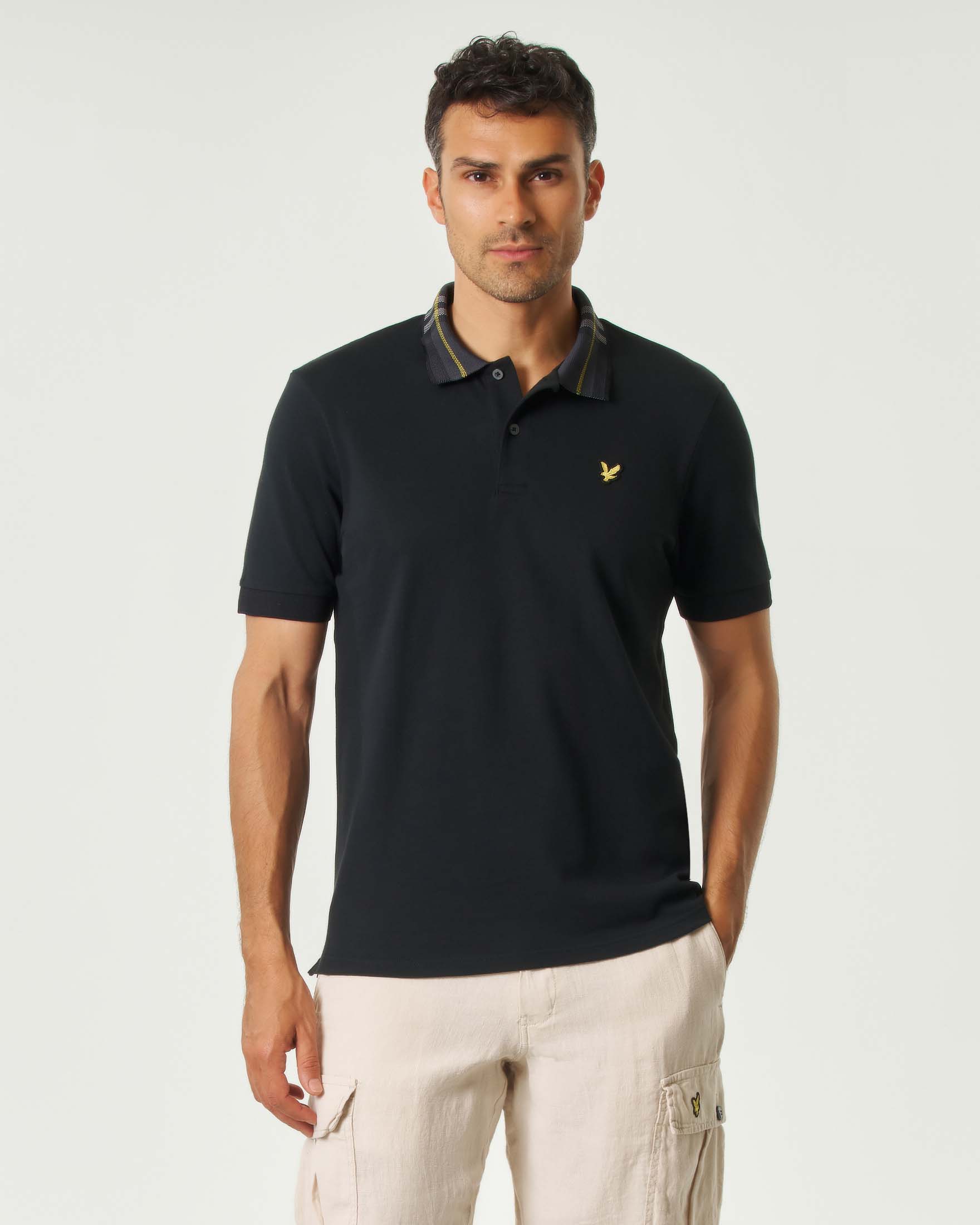 Polo mezza manica nera con colletto tartan check