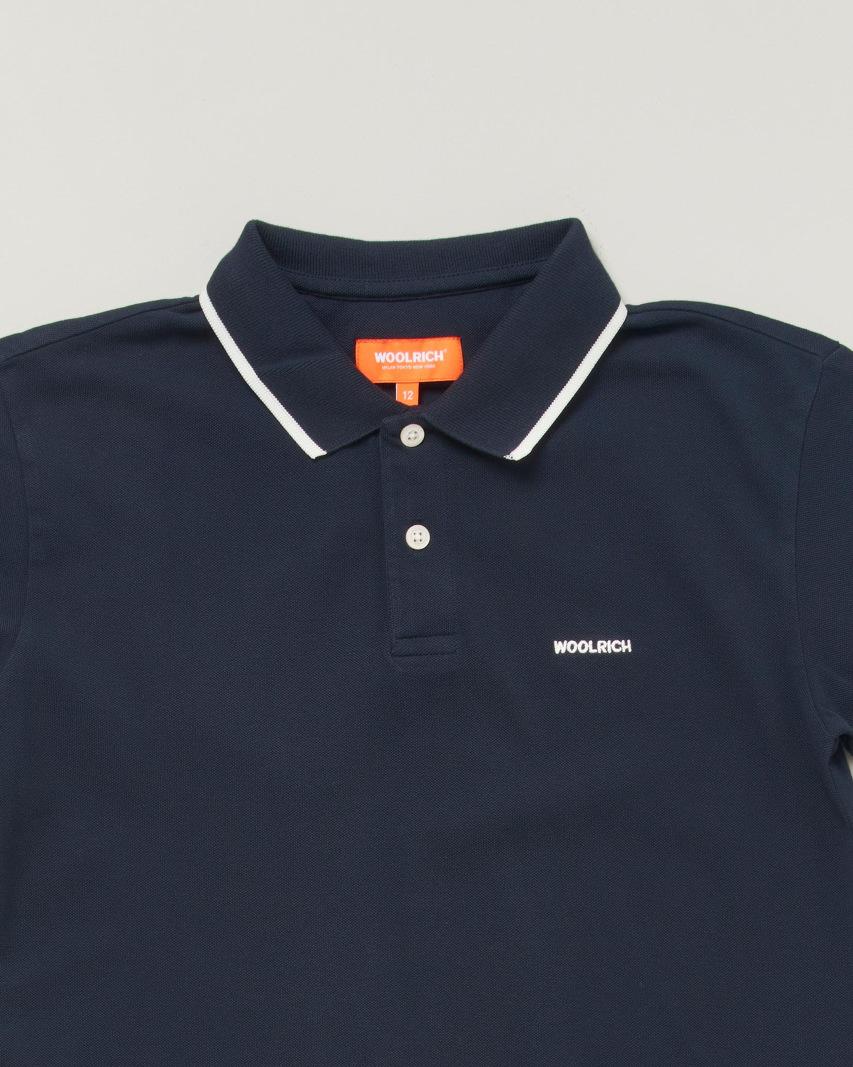 Polo blu Woolrich in puro cotone con rifiniture rosse image