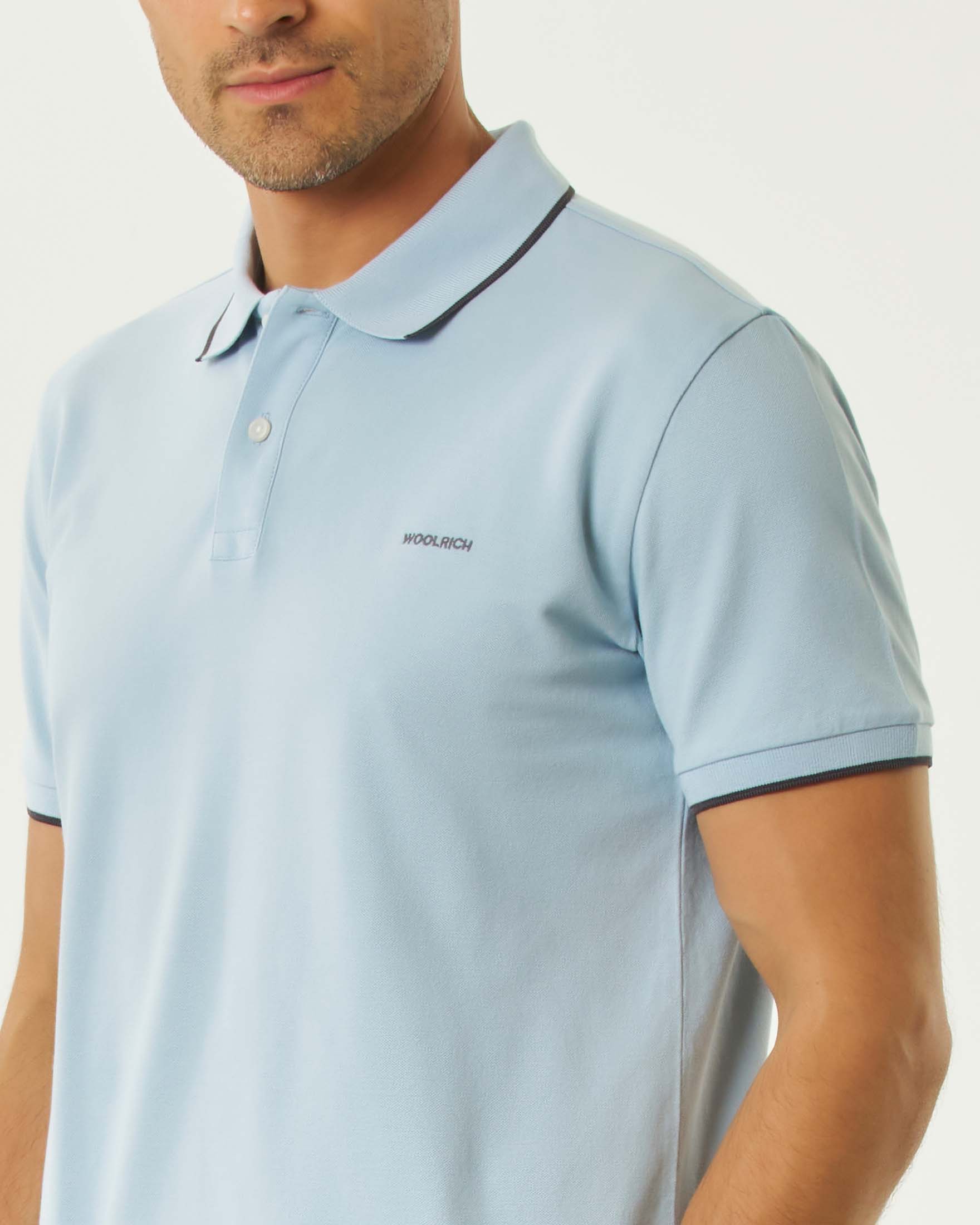 Polo Monterey Woolrich azzurra in piquè di cotone stretch con bordino blu image