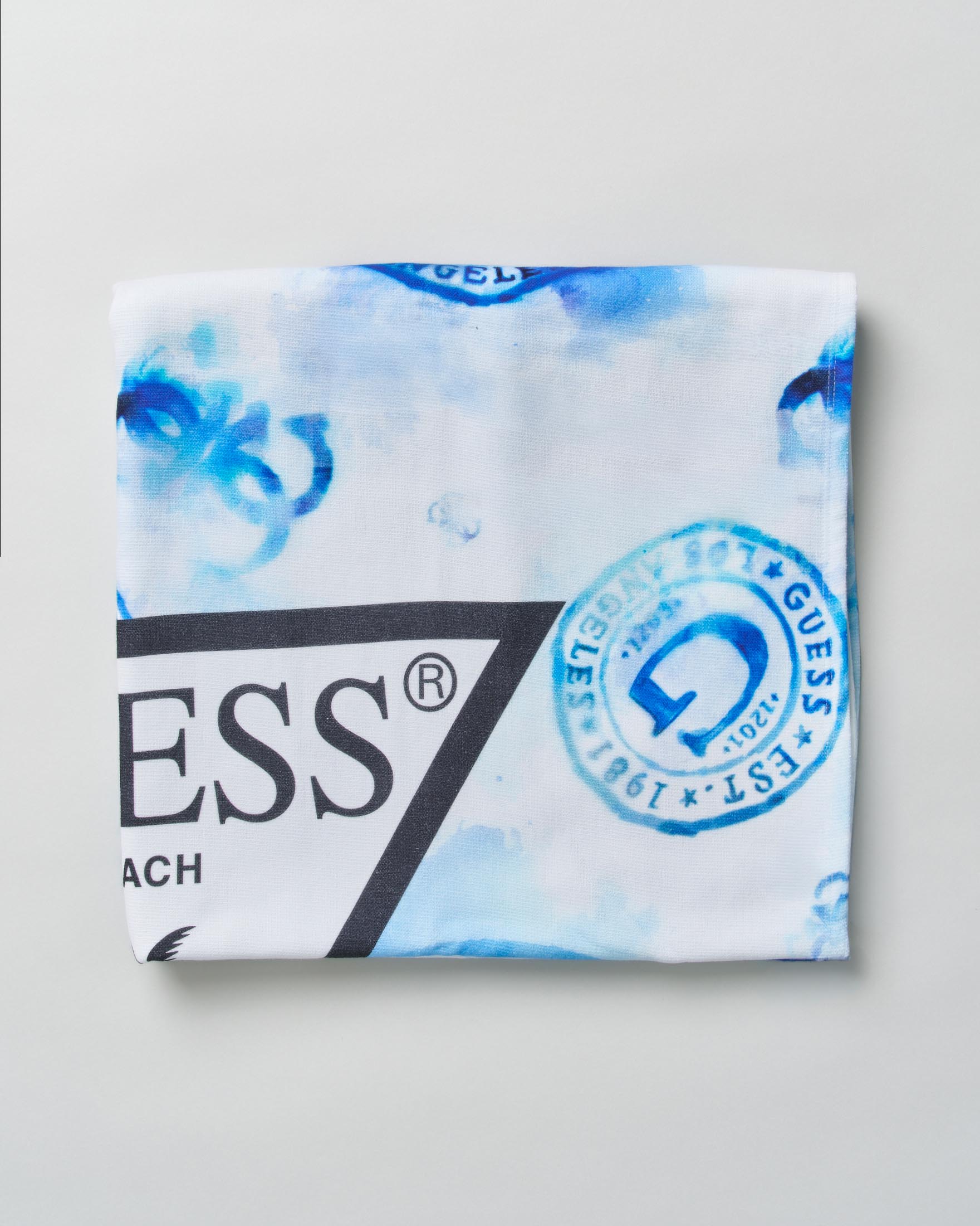 Telo mare azzurro in cotone con stampa logo monogram