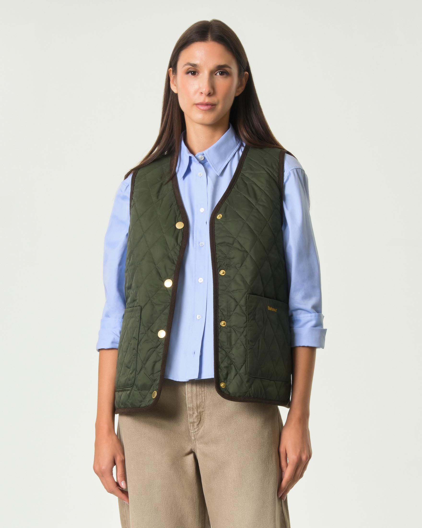 Gilet reversibile trapuntato Liner Barbour verde oliva con interno check e chiusura con automatici