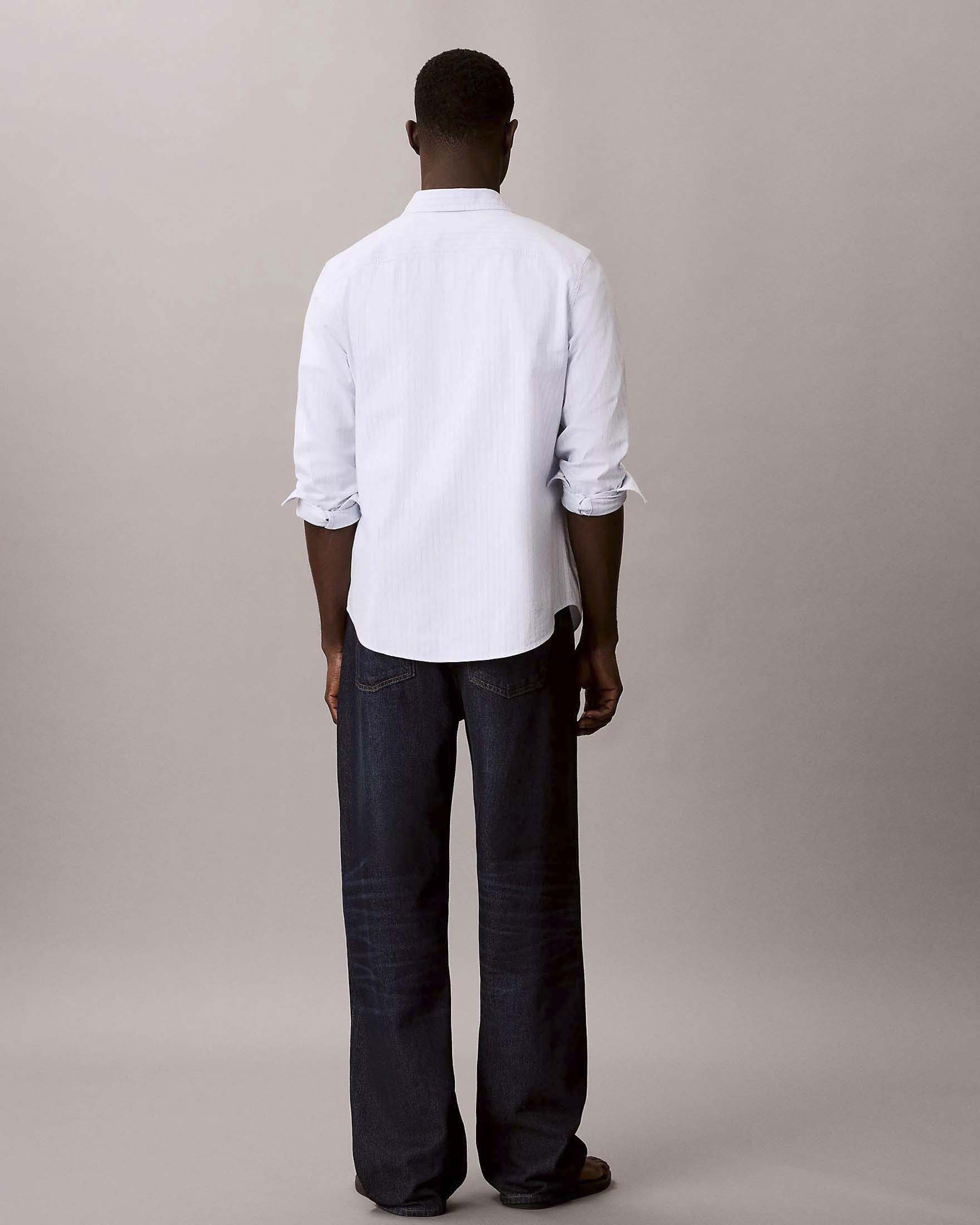Jeans Calvin Klein Jeans lavaggio scuro in cotone con patch logo image