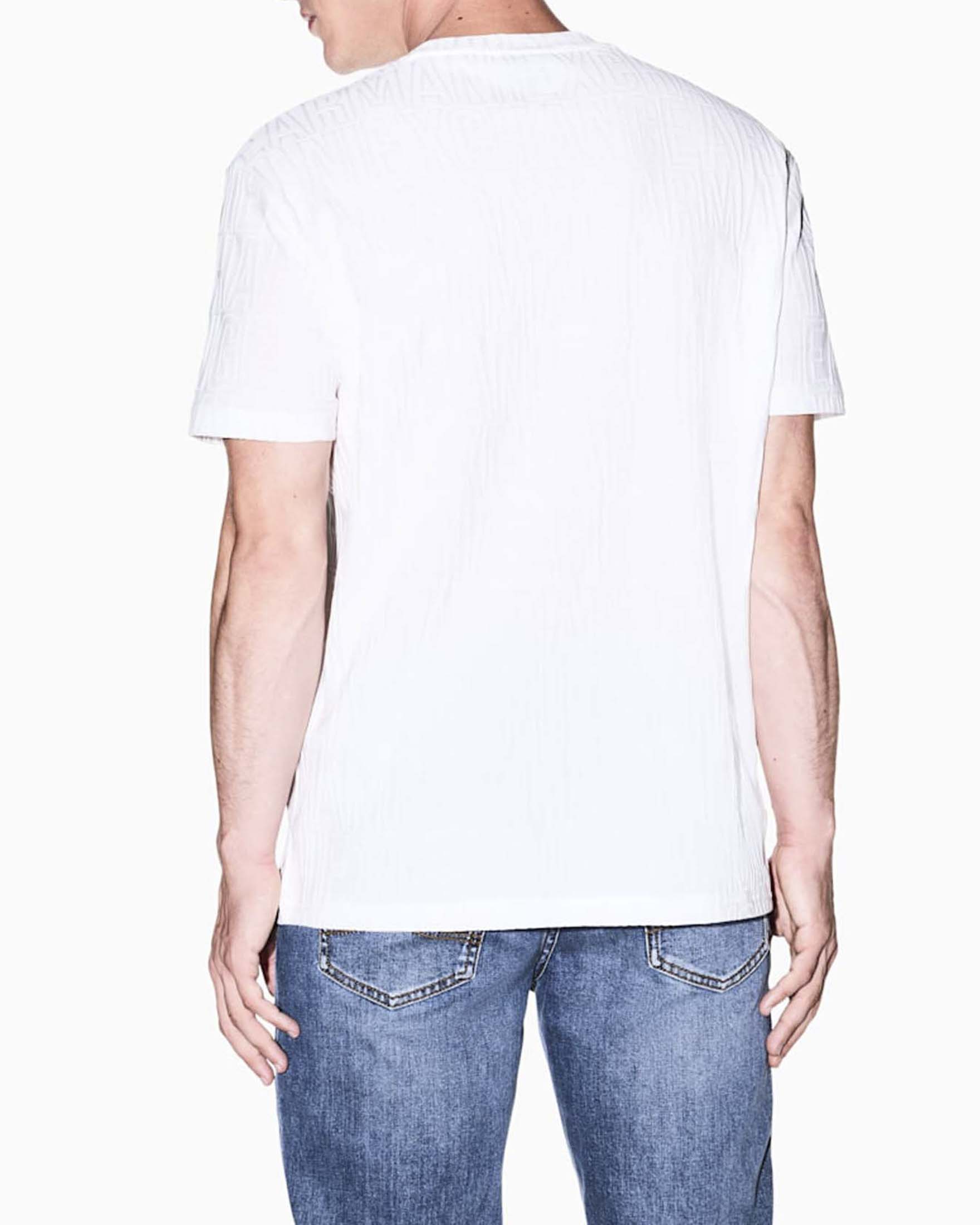 T-shirt Armani Exchange bianca in cotone con logo jacquard in rilievo image
