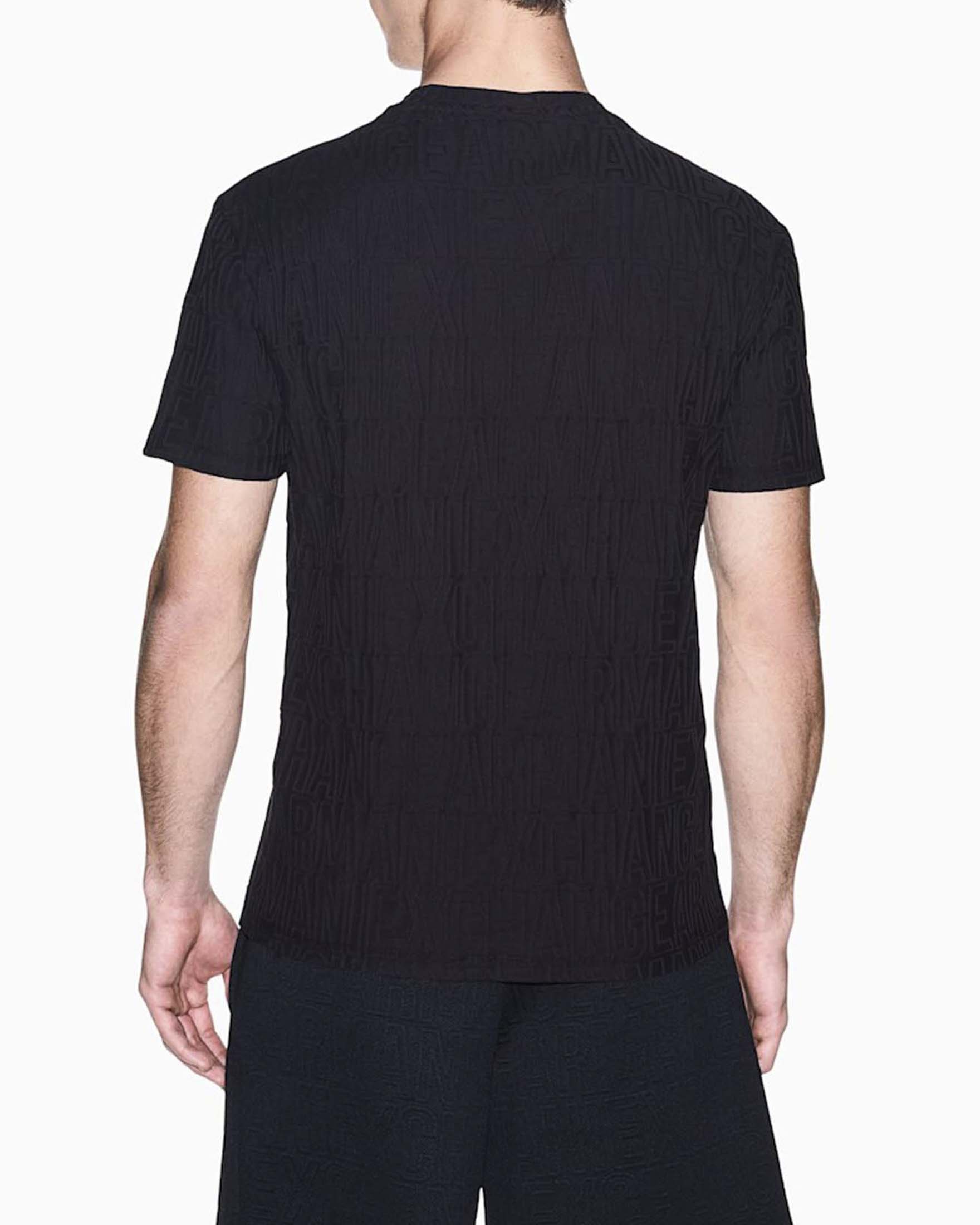 T-shirt Armani Exchange nera in cotone con logo jacquard in rilievo image