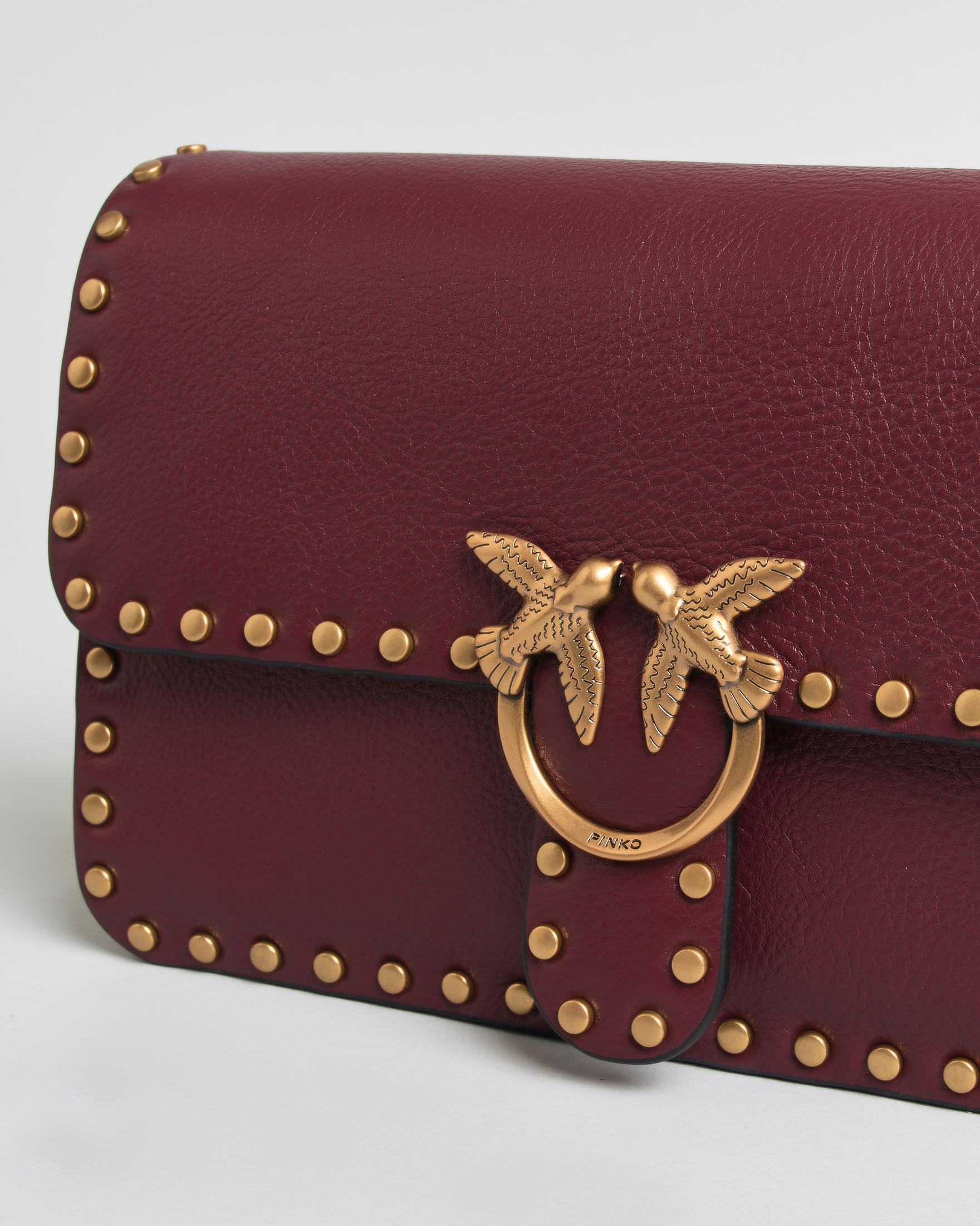 Borsa a tracolla Baby Love Bag One Slouchy Pinko bordeaux in pelle con borchie e logo dorati image